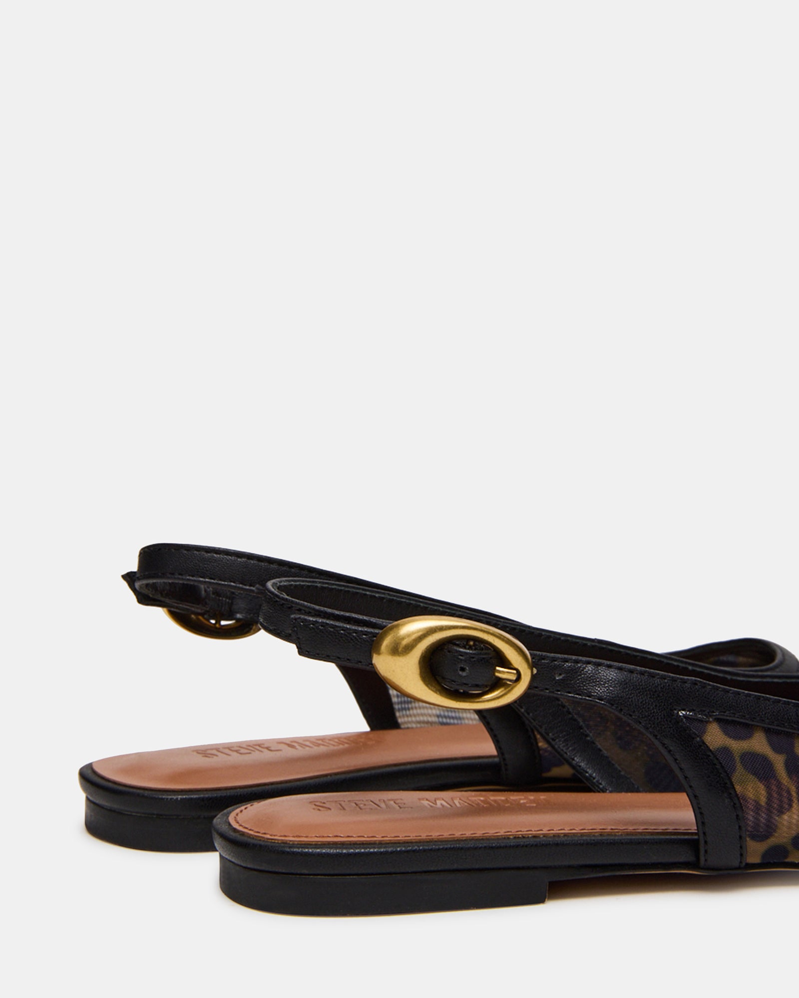 Close-up of the pointed toe and leopard trim on these dress flats