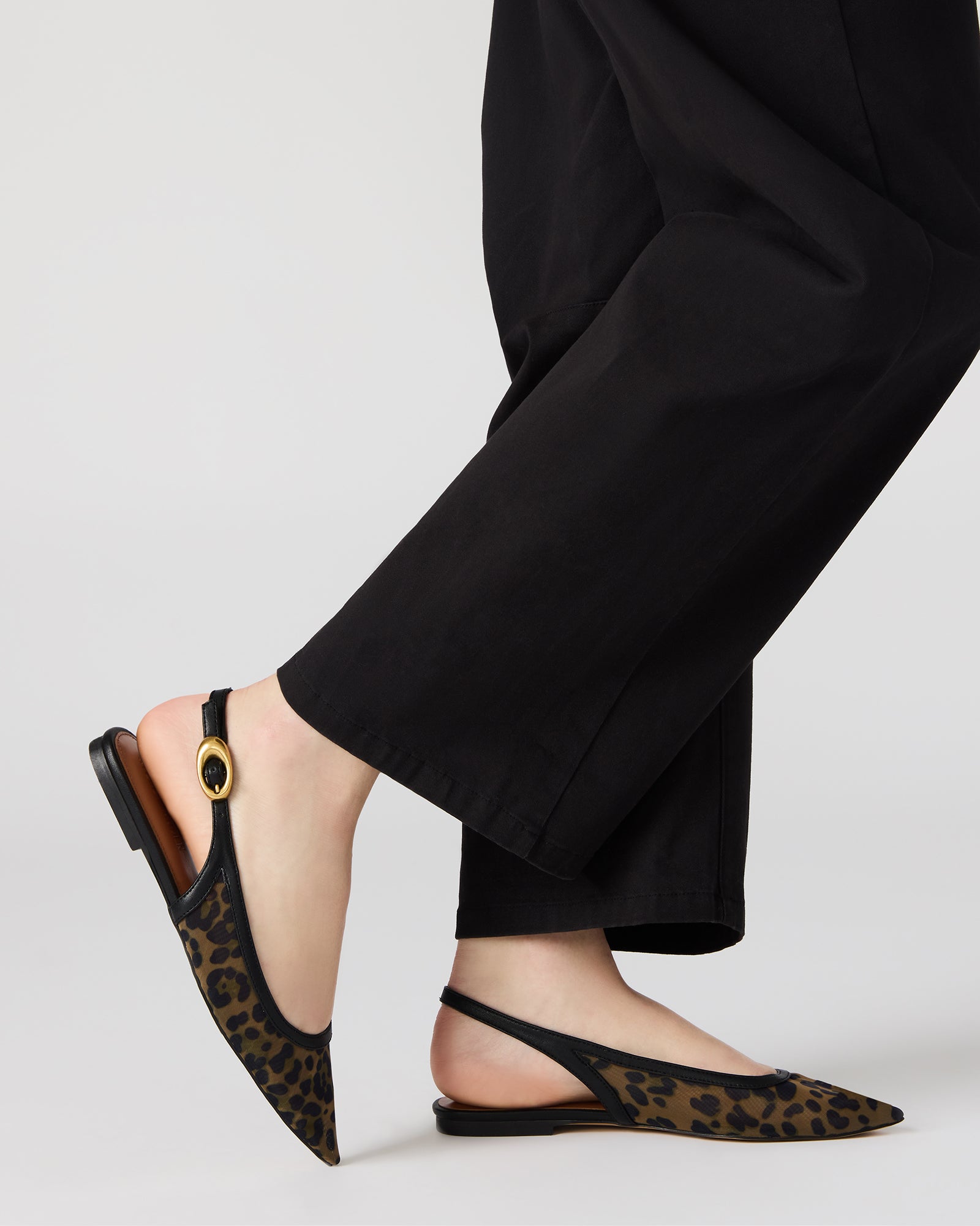 Close-up of the pointed toe and leopard trim on these dress flats