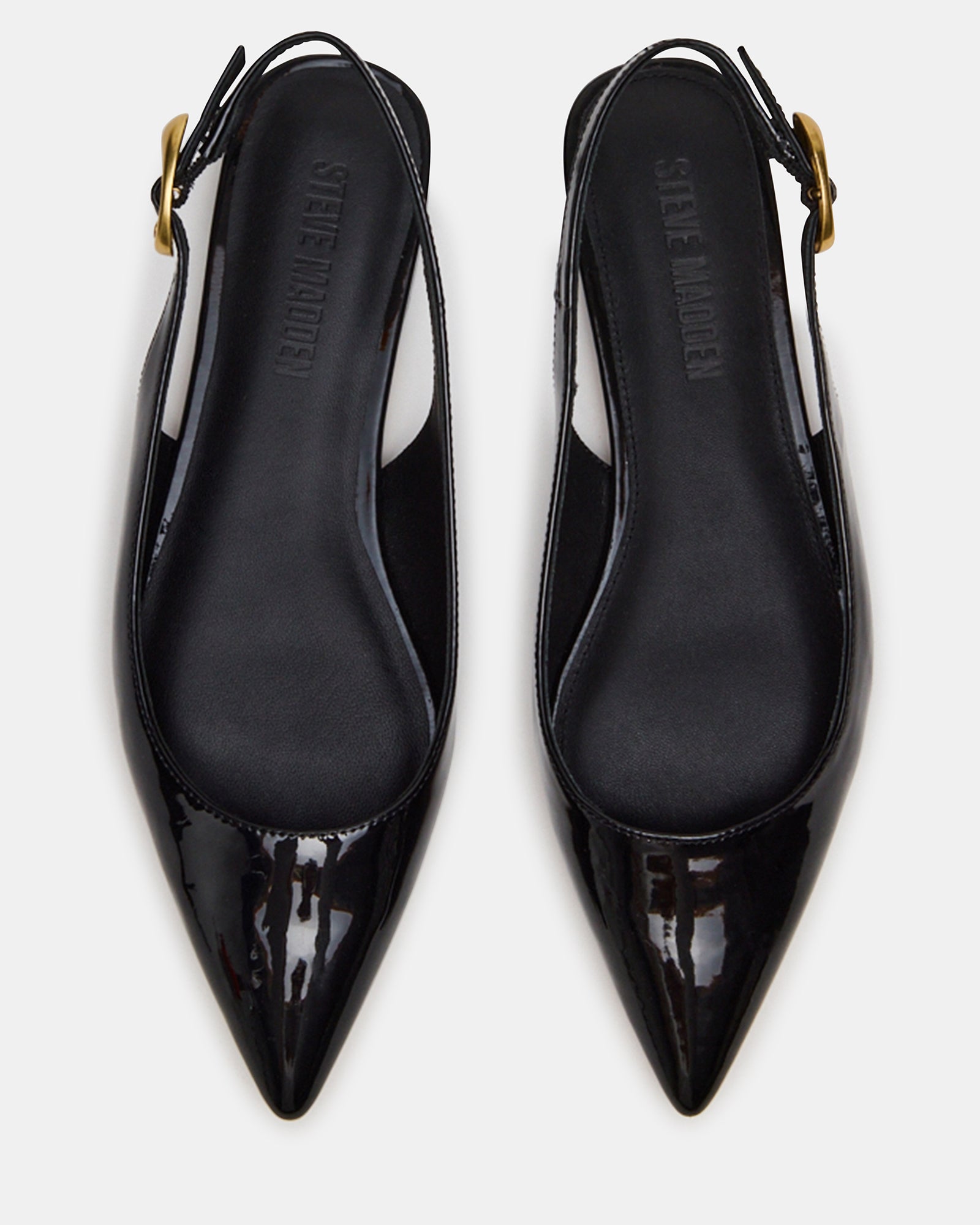 Close-up of pointed toe design on stylish slingback flats.