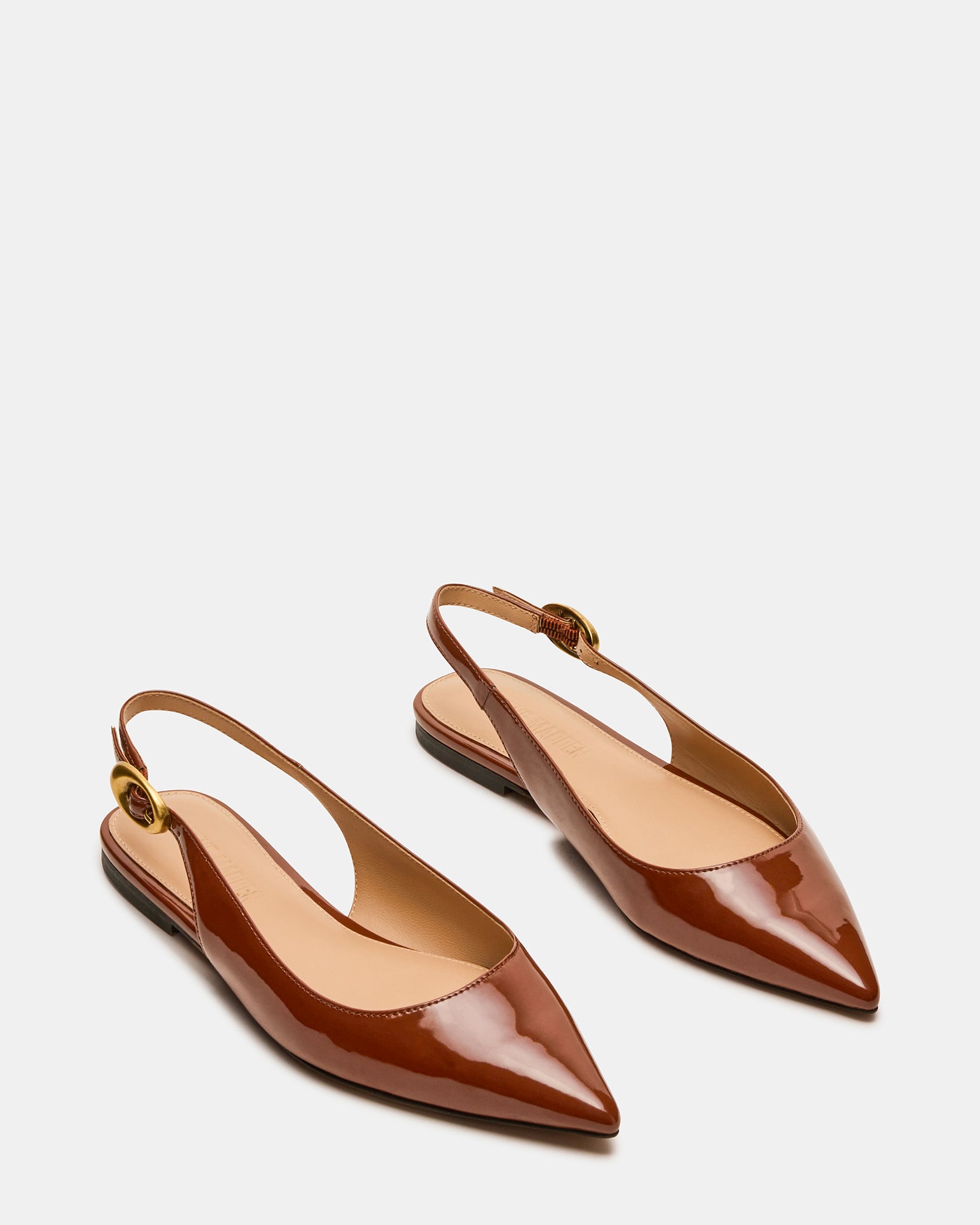Close-up of black slingback flats showing heel and sleek upper material