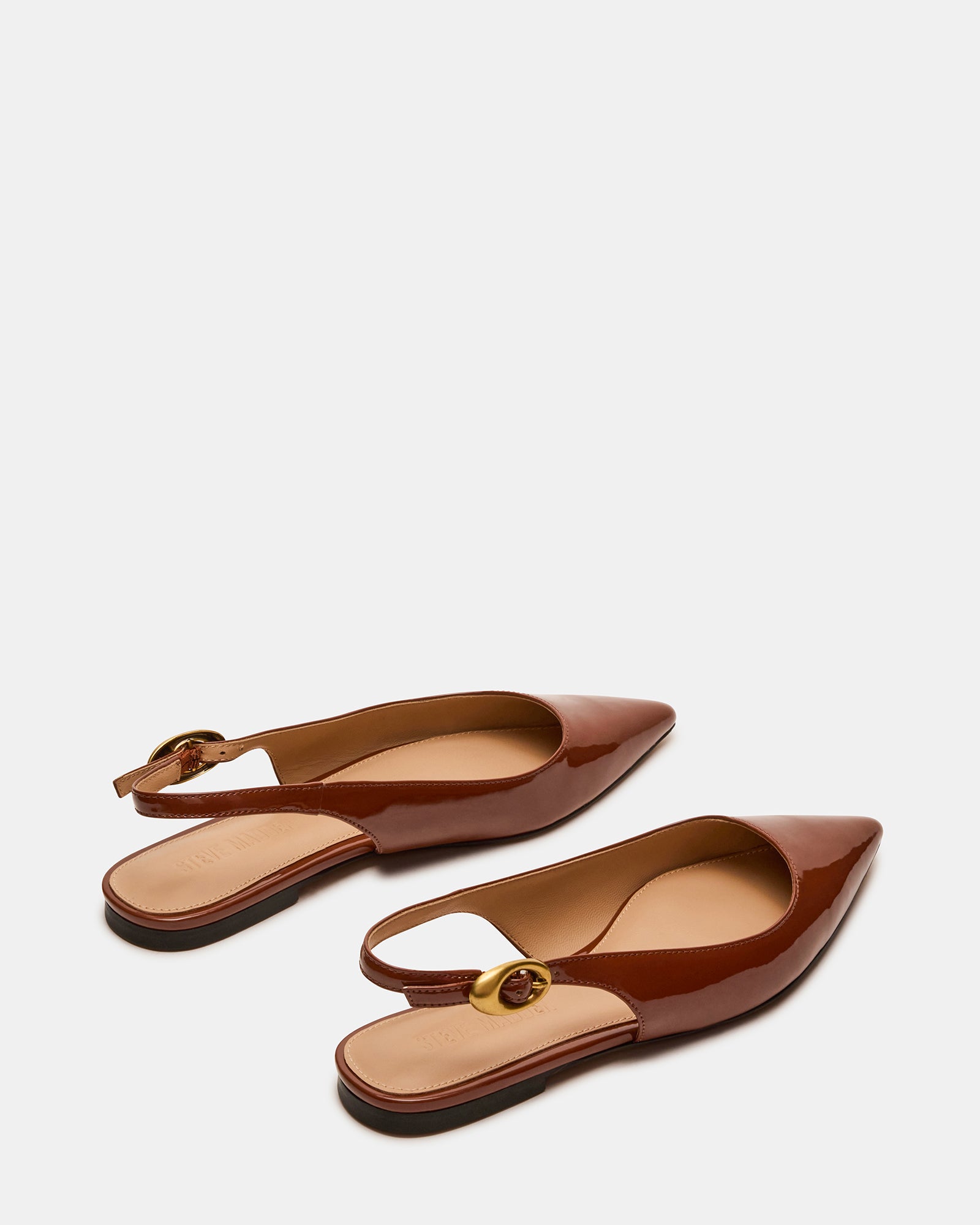 Close-up of black slingback flats showing heel and sleek upper material