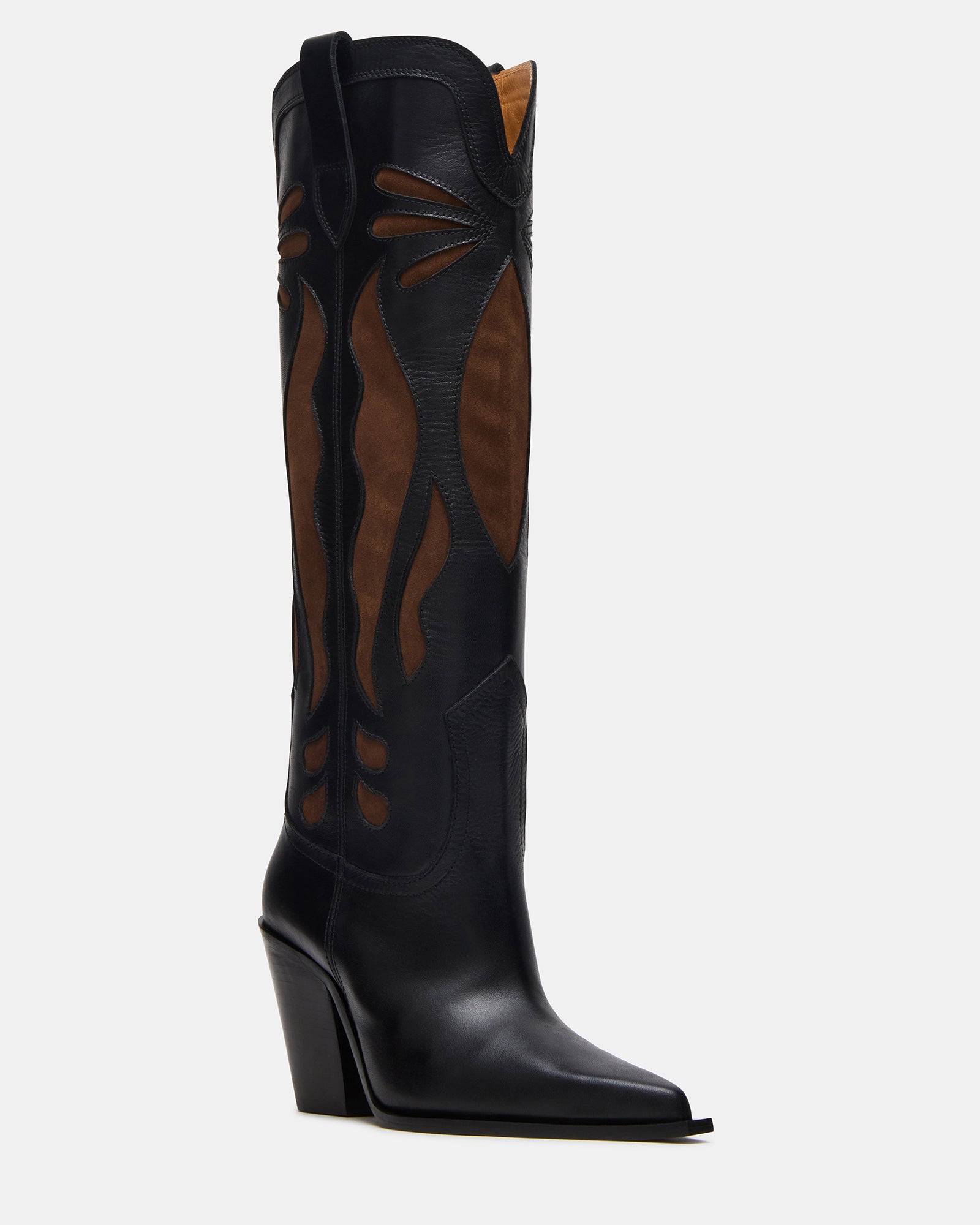 Brown knee high boots paired with jeans for everyday wear