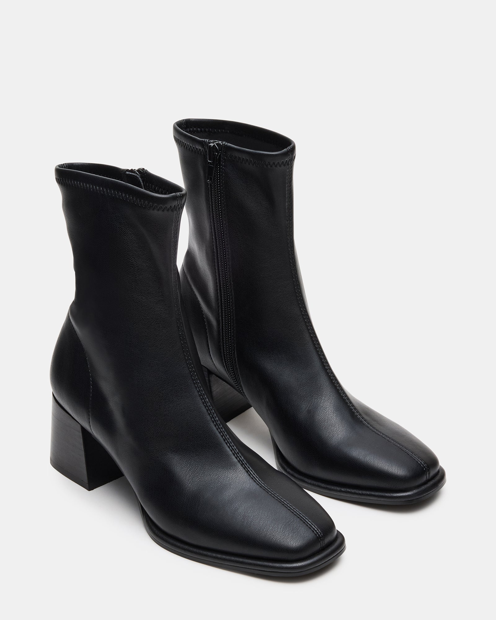 Close-up of Pammy black ankle boots highlighting the vegan leather material.