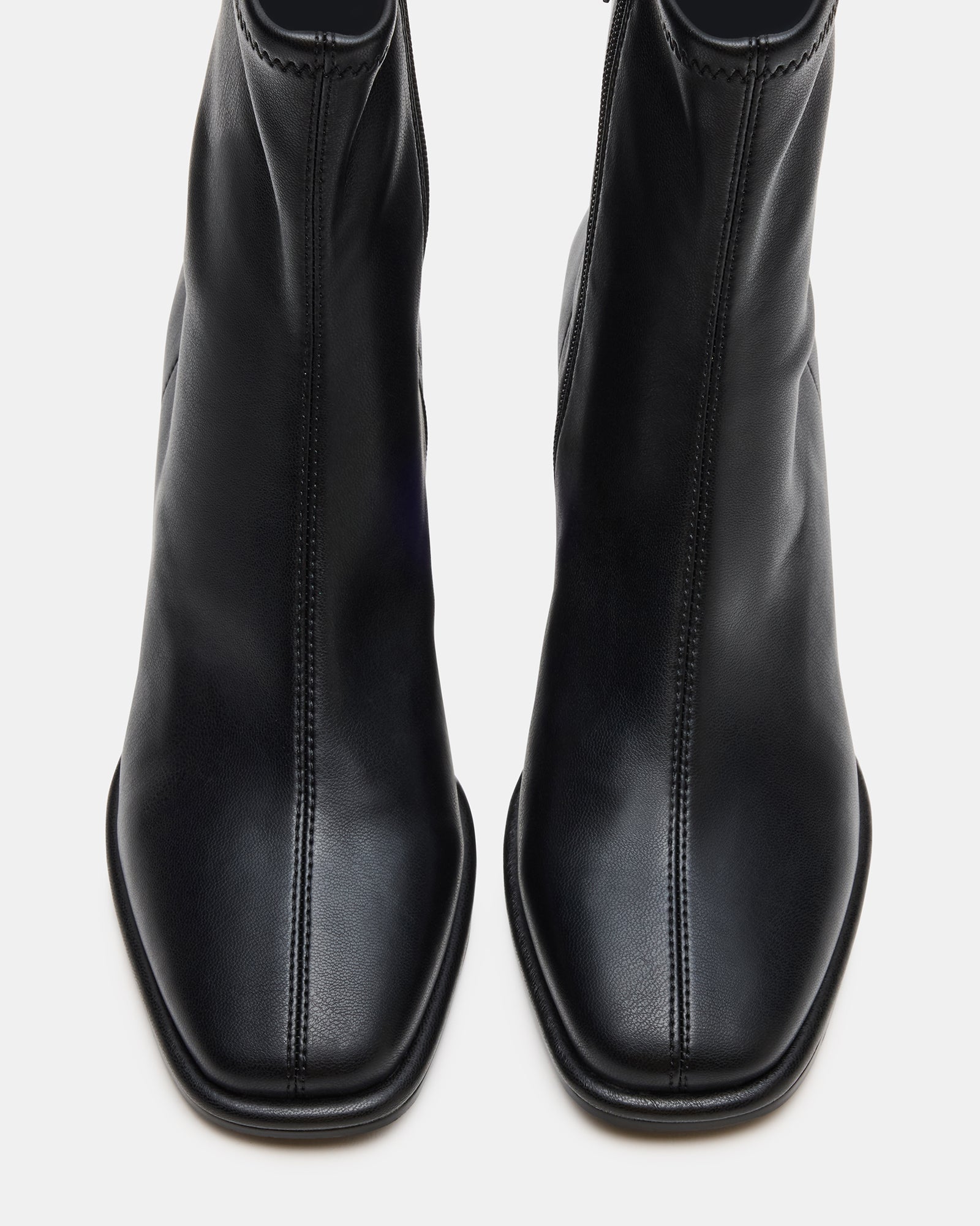 Pammy vegan black ankle boots worn with a casual outfit.