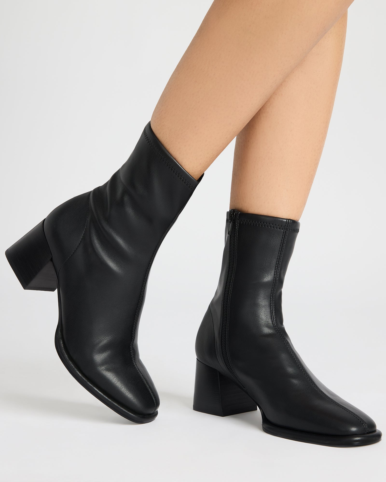 Pammy vegan black ankle boots worn with a casual outfit.