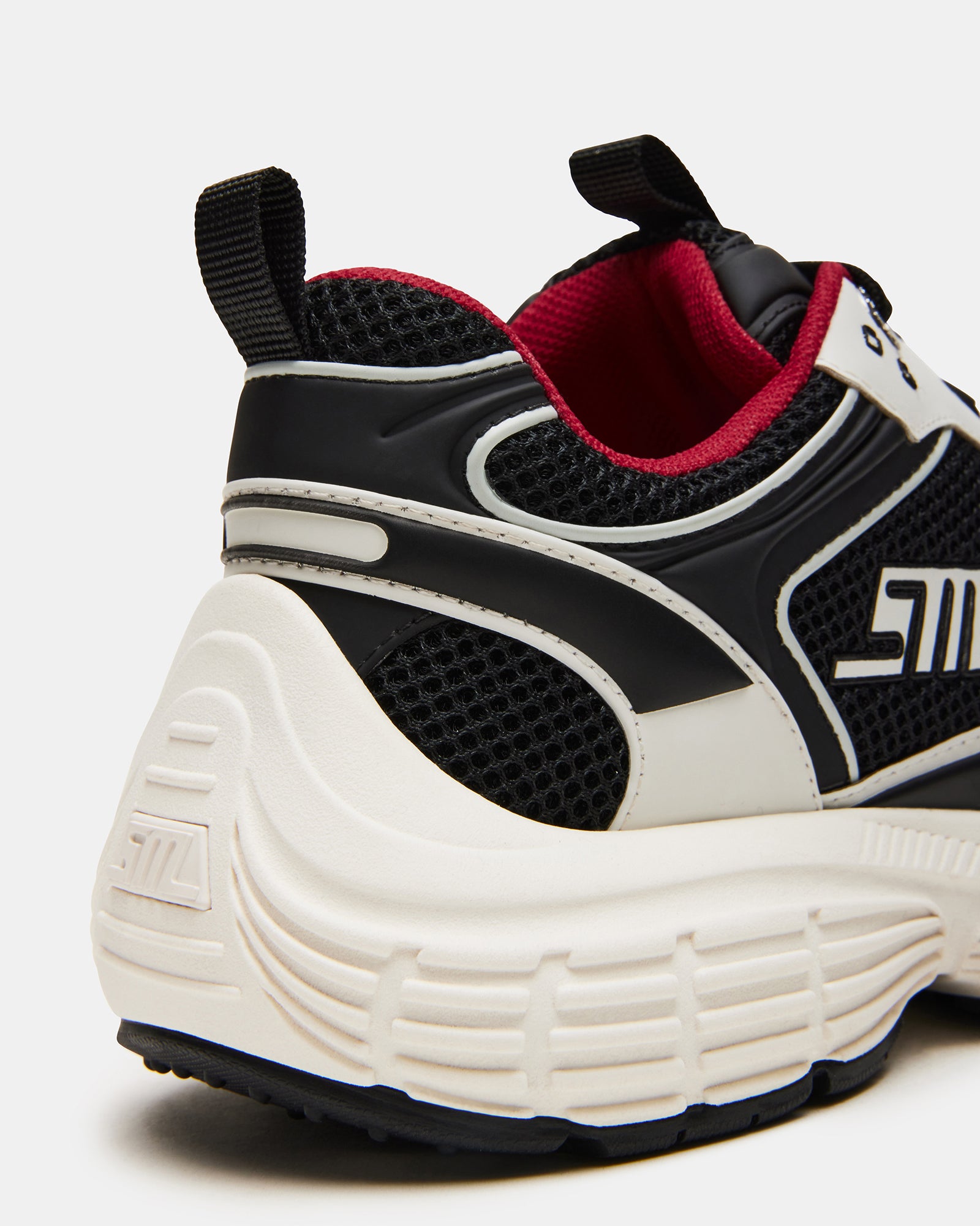 Lifestyle photo of black sneakers women styled with jeans for city walks.
