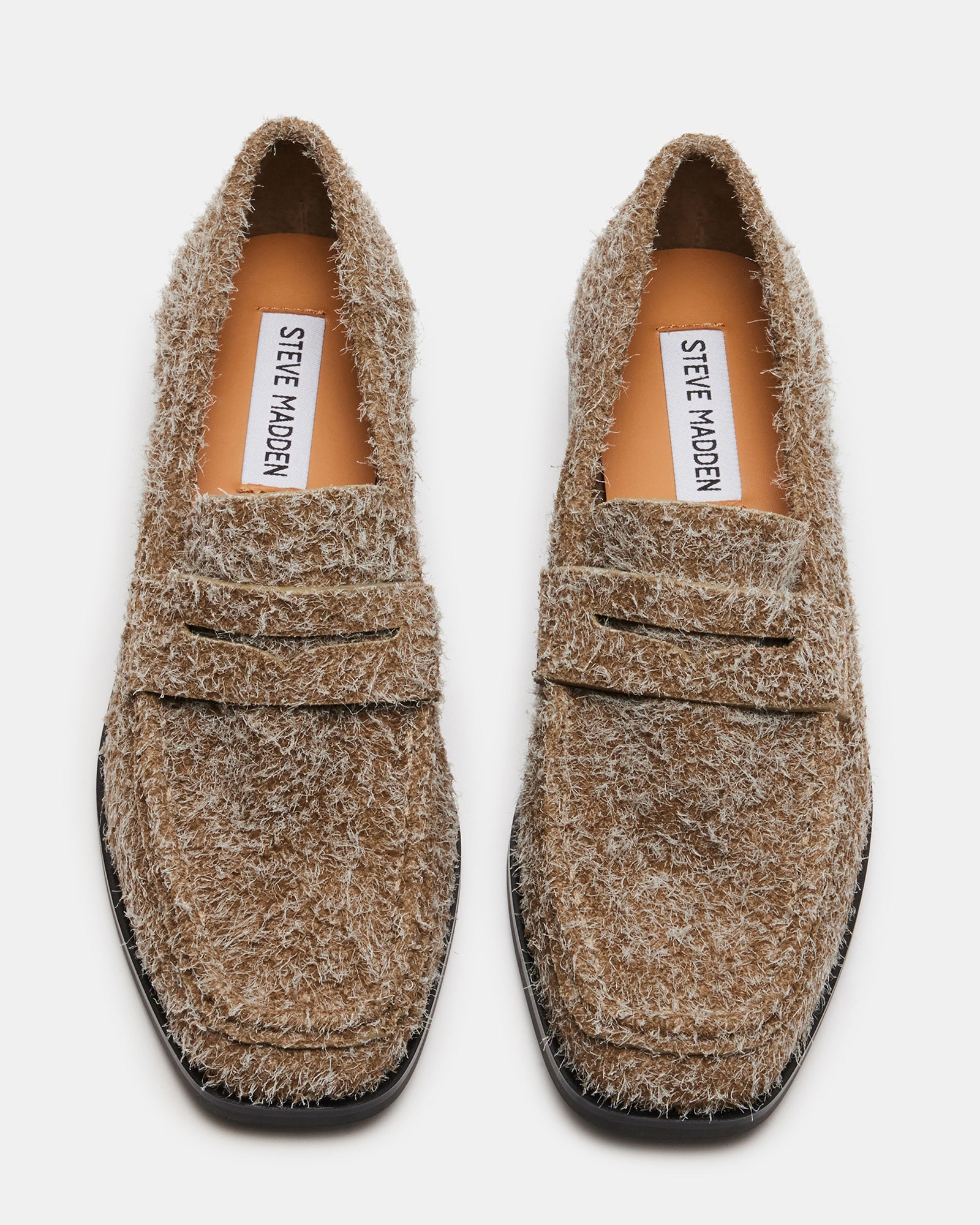 Side view of grey suede loafers showing squared toe and 1-inch heel