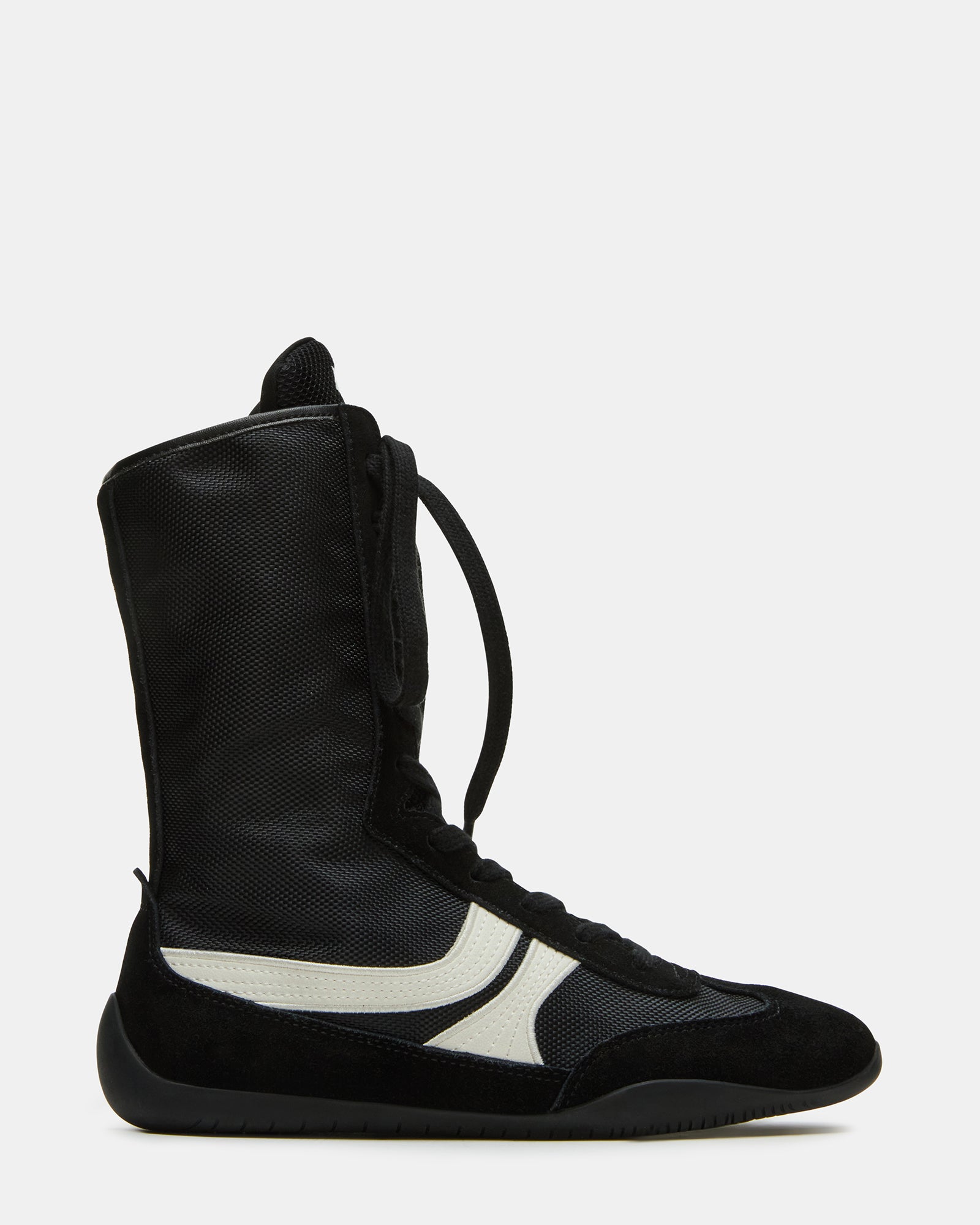 Top-down view of Paxtin black high top sneakers styled with cuffed jeans