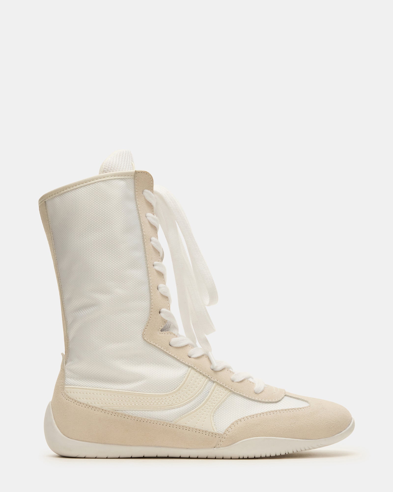 Close-up of black high top sneakers showing suede texture and stitching detail.