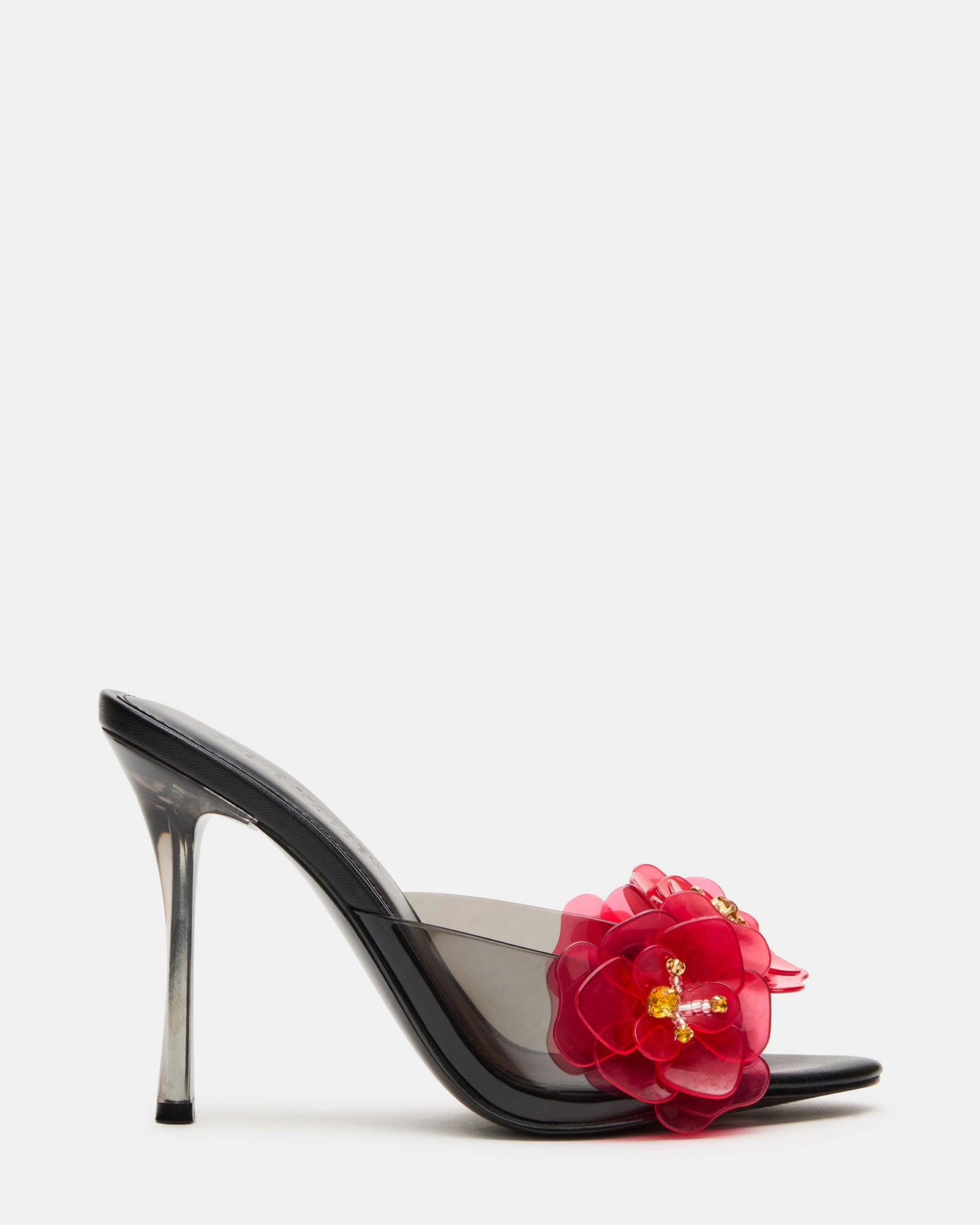 Close-up of Petunia black stiletto mule heels with floral design.