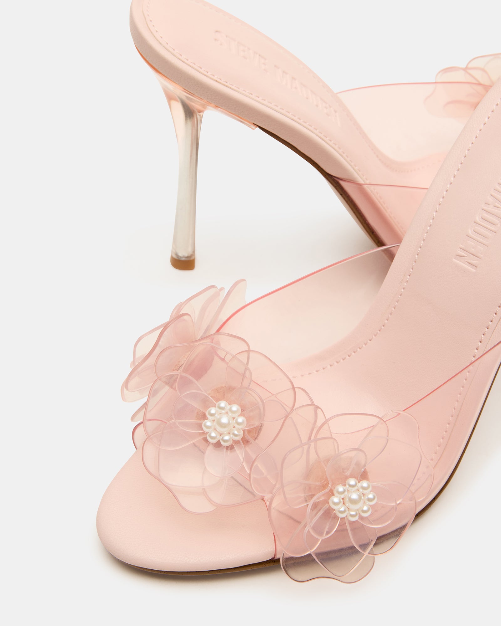 Close-up of the floral accents on the high heels in pink.