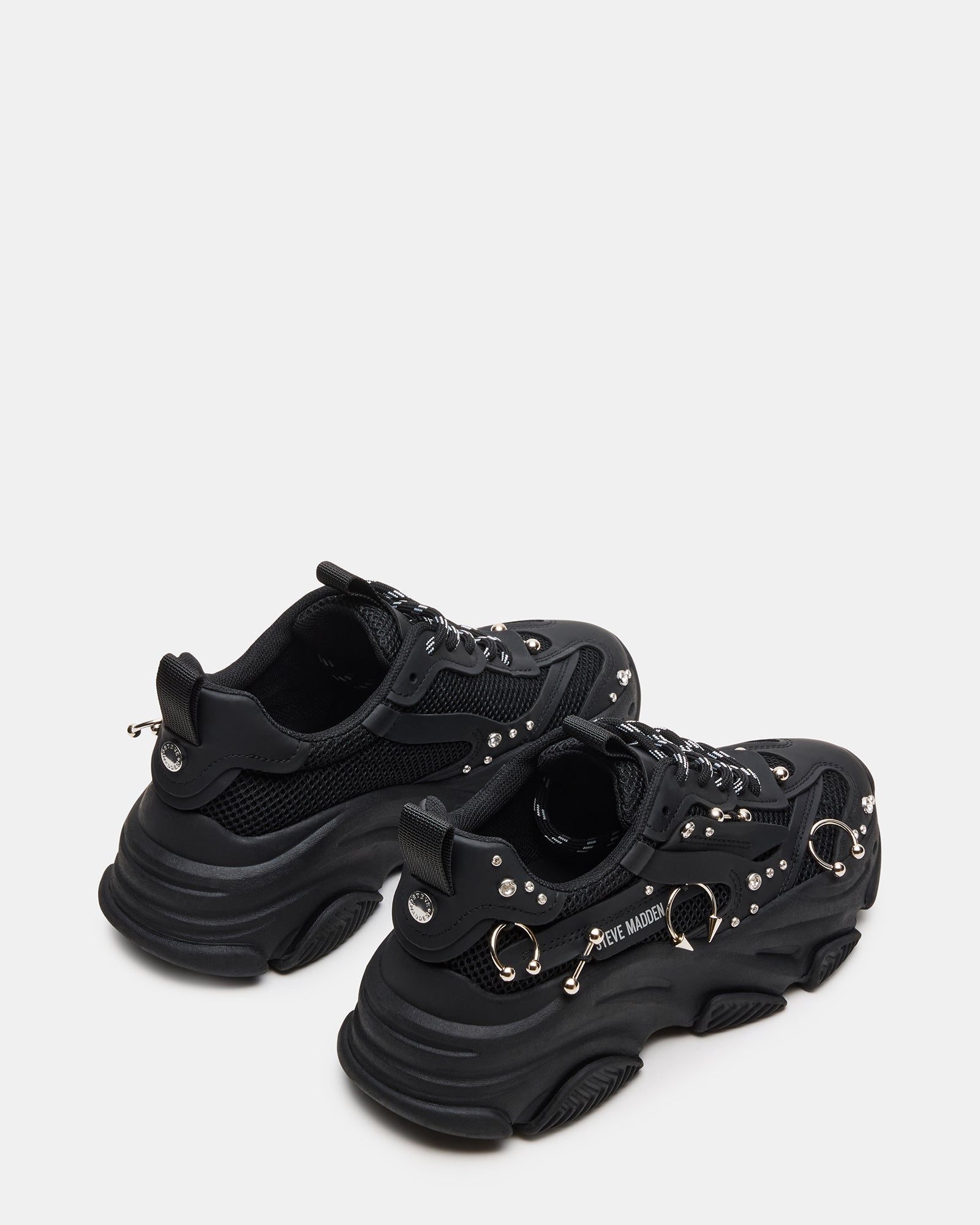 Top-down view of comfortable work sneakers for men styled with business-casual trousers