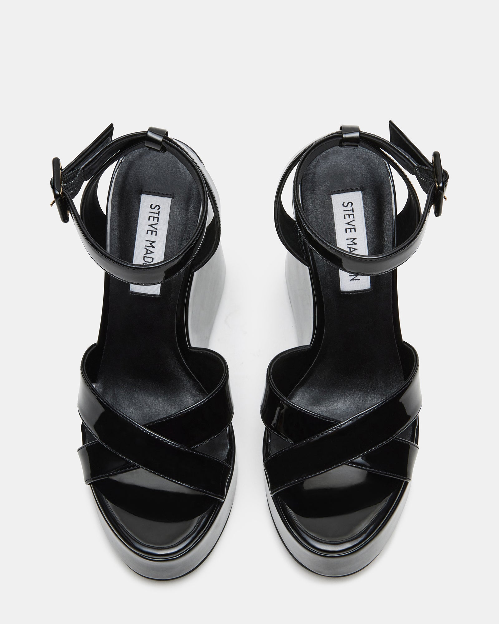 Top view of stylish black platform sandals with crisscross detail and synthetic finish