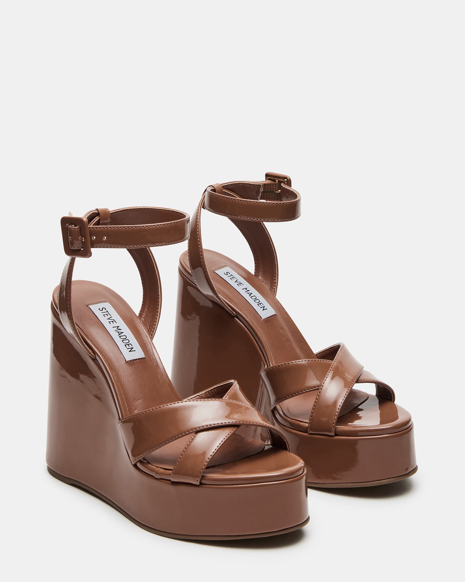 Black platform sandals on pavement demonstrating walkability