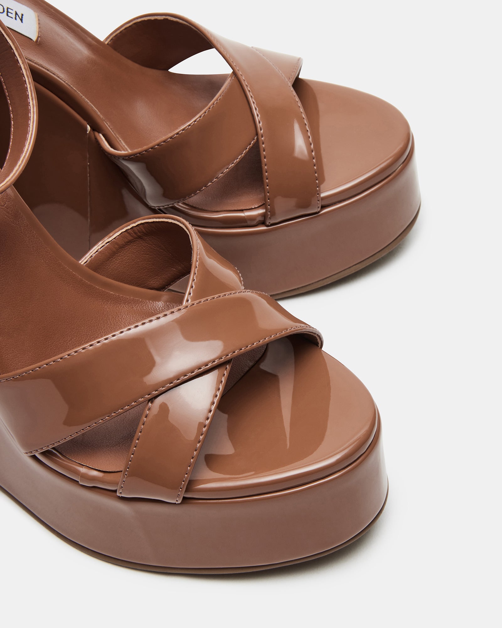 Close-up of Gucci-inspired platform sandals wedge heel detail