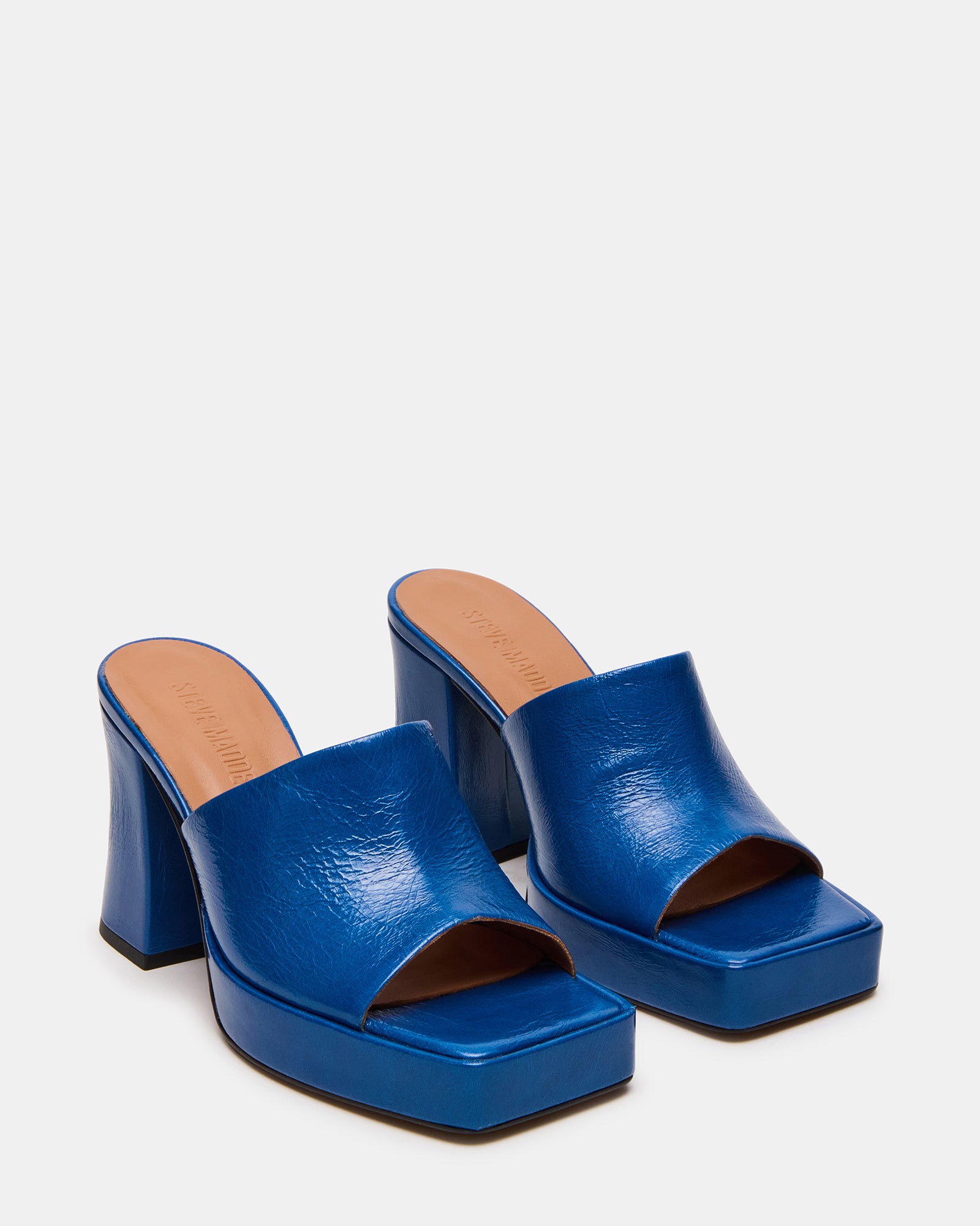 Side angle of the block heel mule shoes emphasizing comfort and style