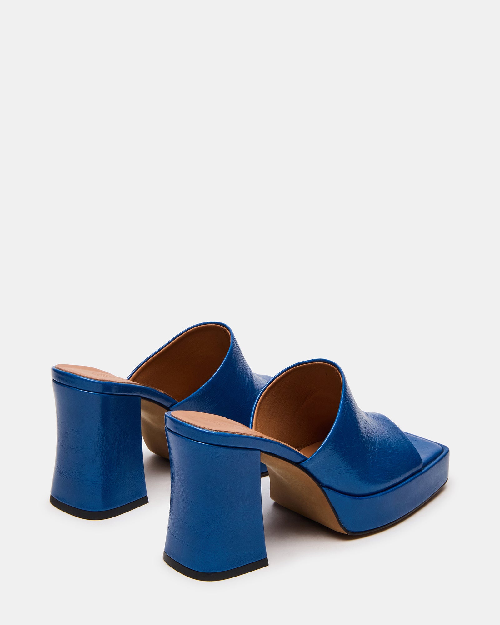 Side angle of the block heel mule shoes emphasizing comfort and style