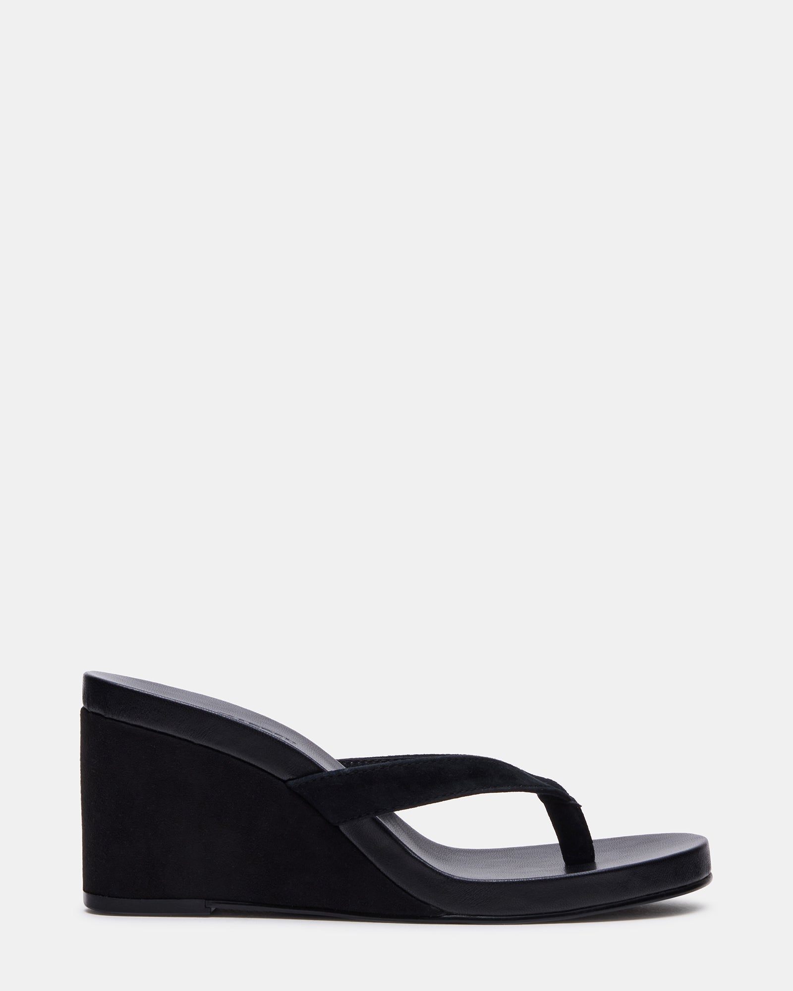 Side view of the black suede wedge sandal showing the 3-inch heel and sleek design