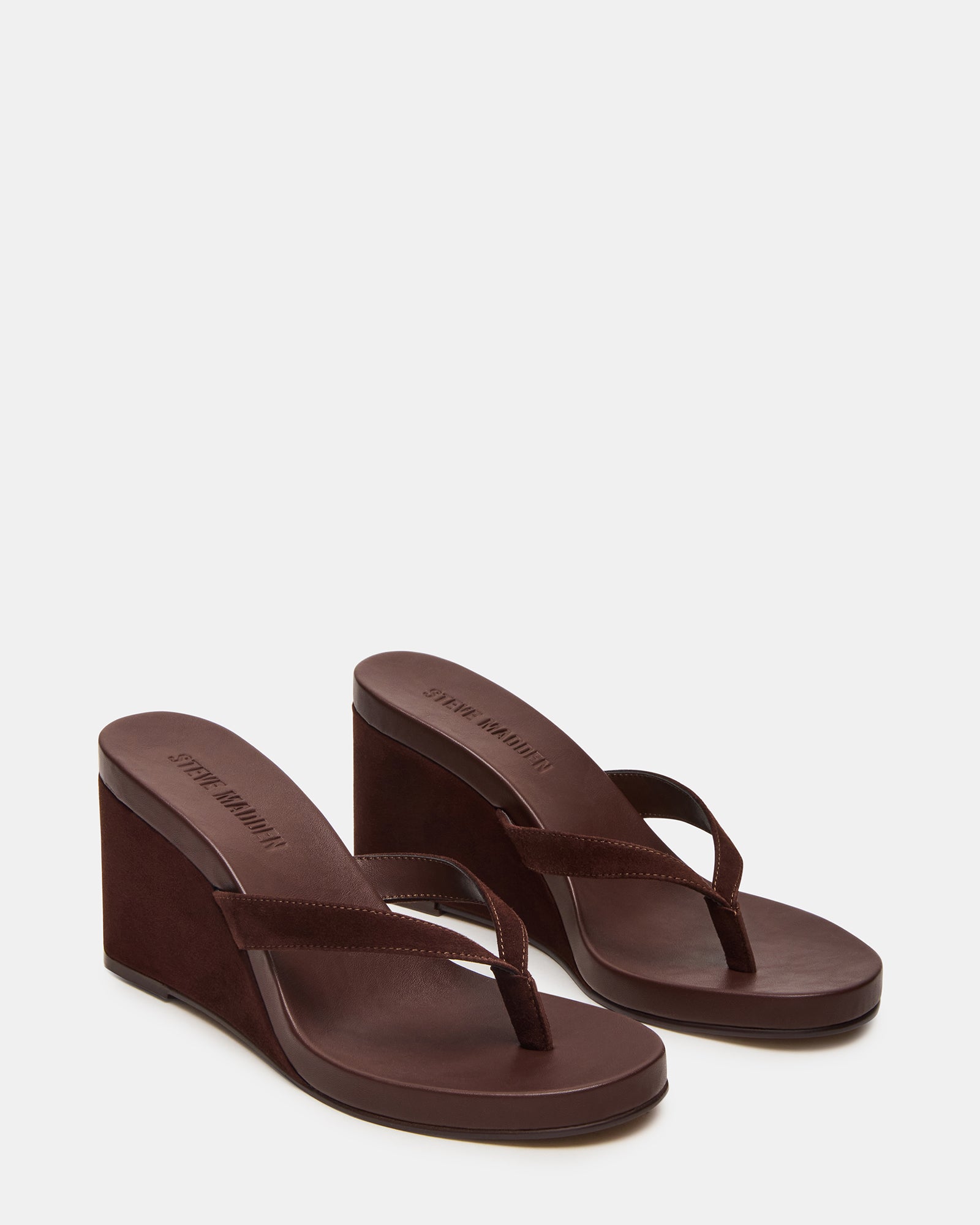 Side view of the brown suede wedge sandals showing the 3-inch heel and rounded toe