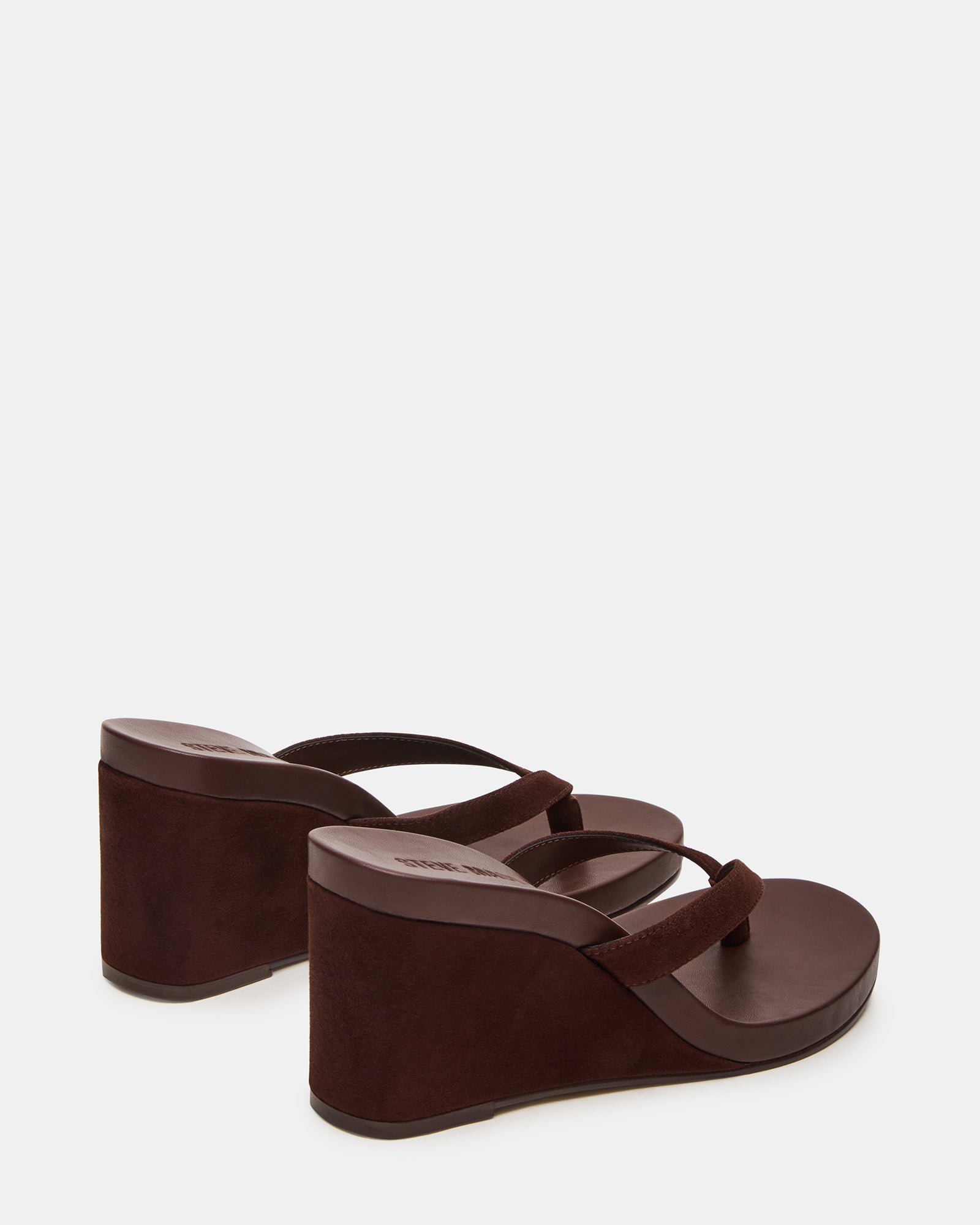 Side view of the brown suede wedge sandals showing the 3-inch heel and rounded toe