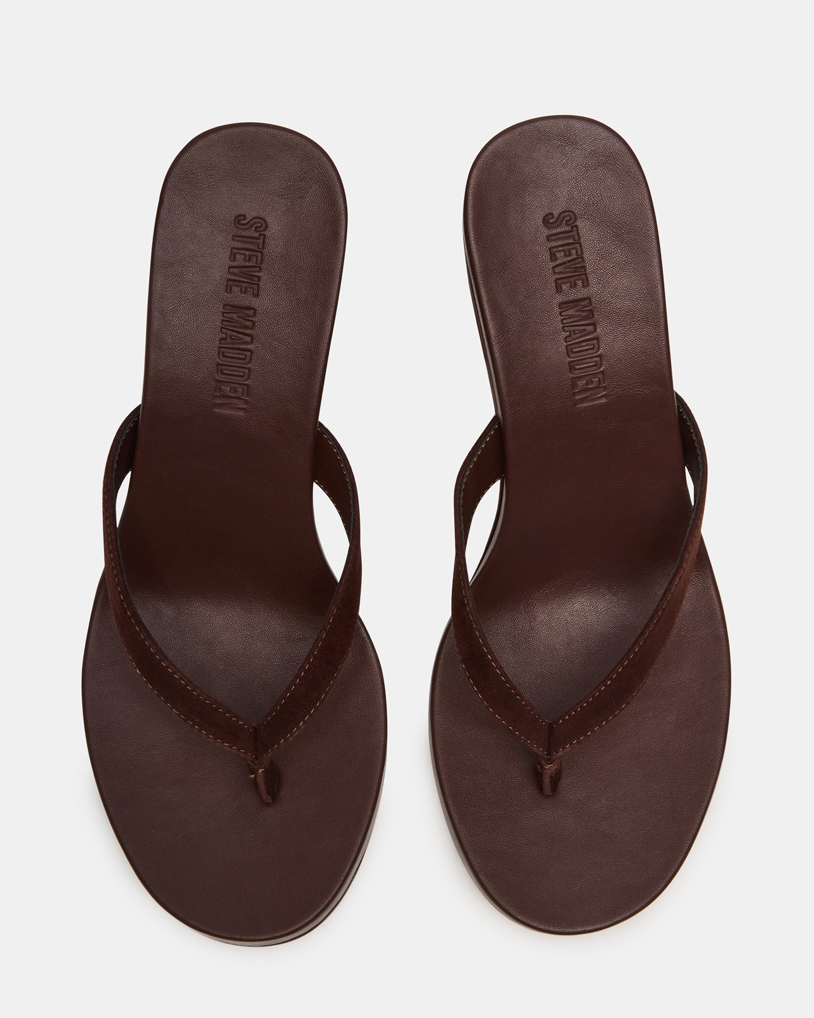 Brown suede wedge sandals with a comfortable thong strap and stylish heel for summer wear