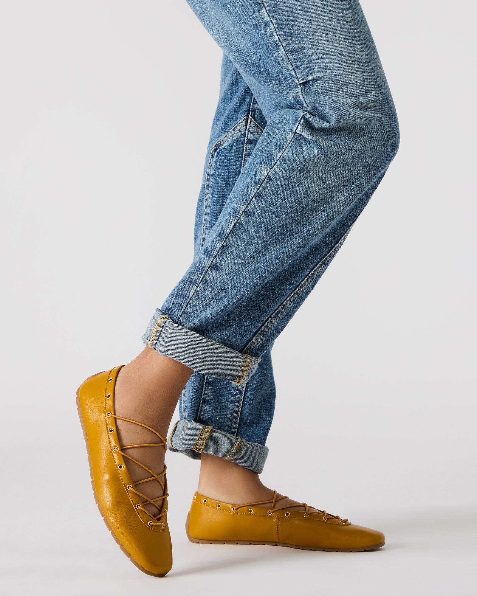Close-up of leather flats showcasing the square toe design.