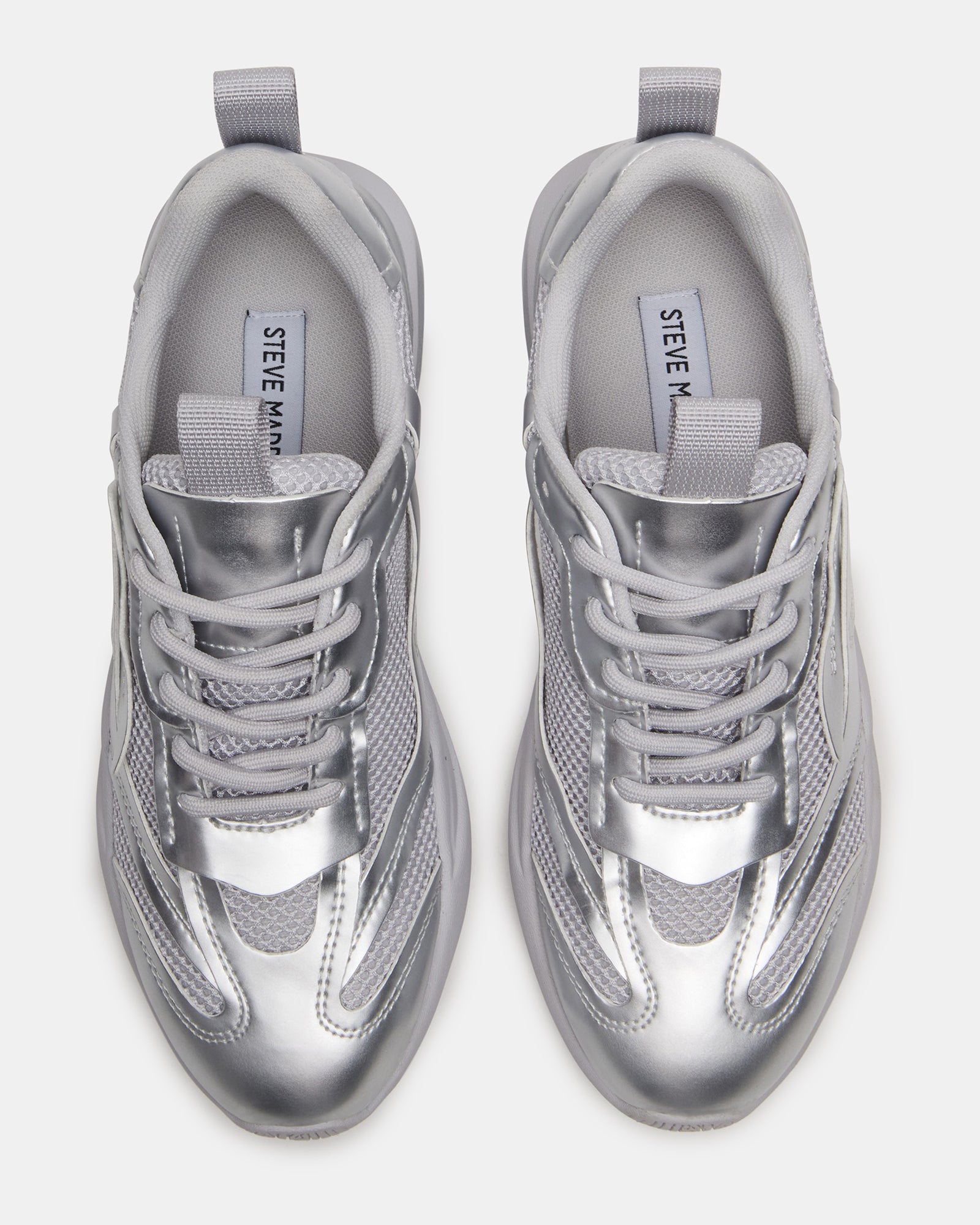 Side view of Pounce Silver low-top sneakers showcasing stylish design and white finish