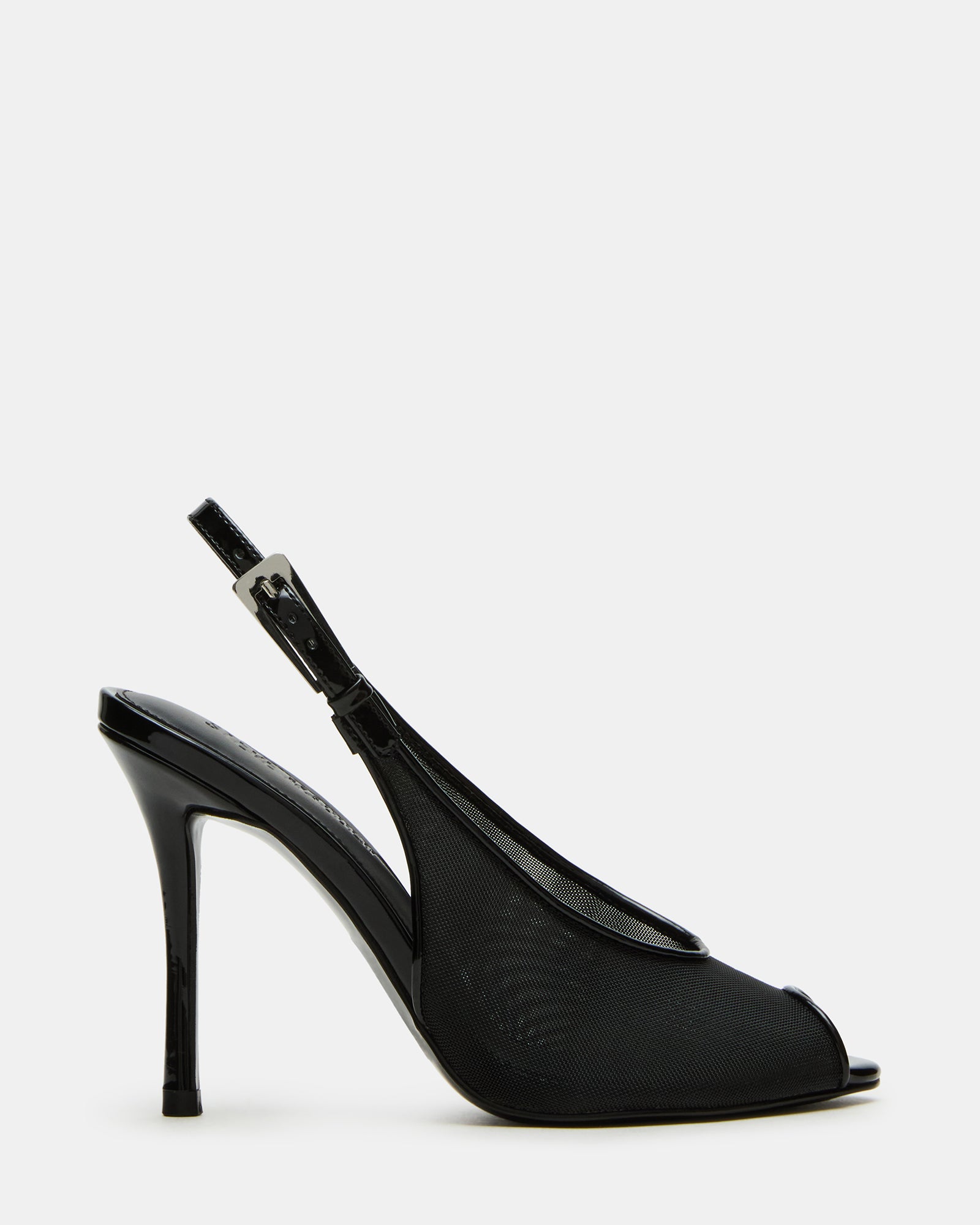 Side view of black stiletto heels with slingback strap on hardwood floor