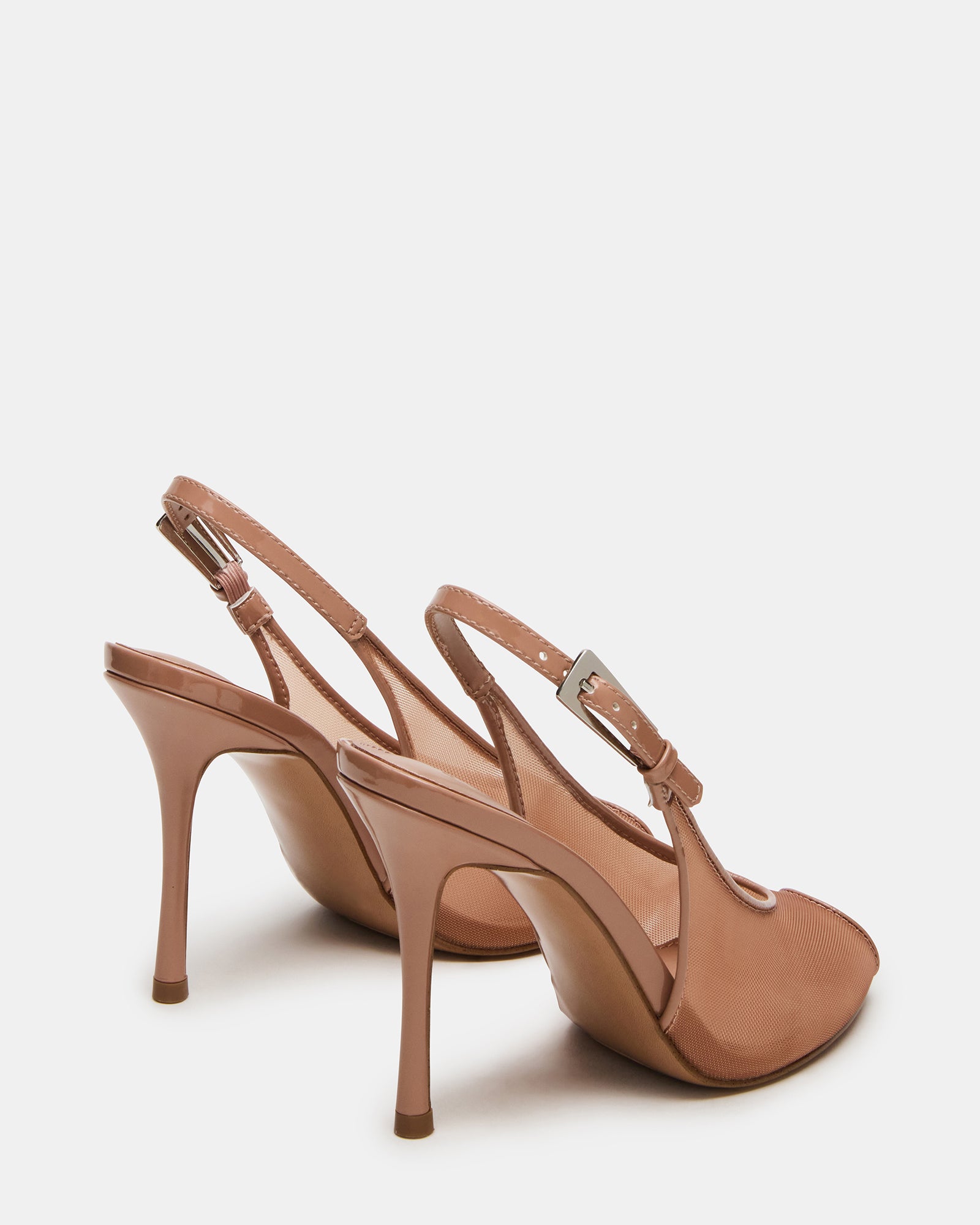 Close-up of silver slingback heels styled with evening wear for date night