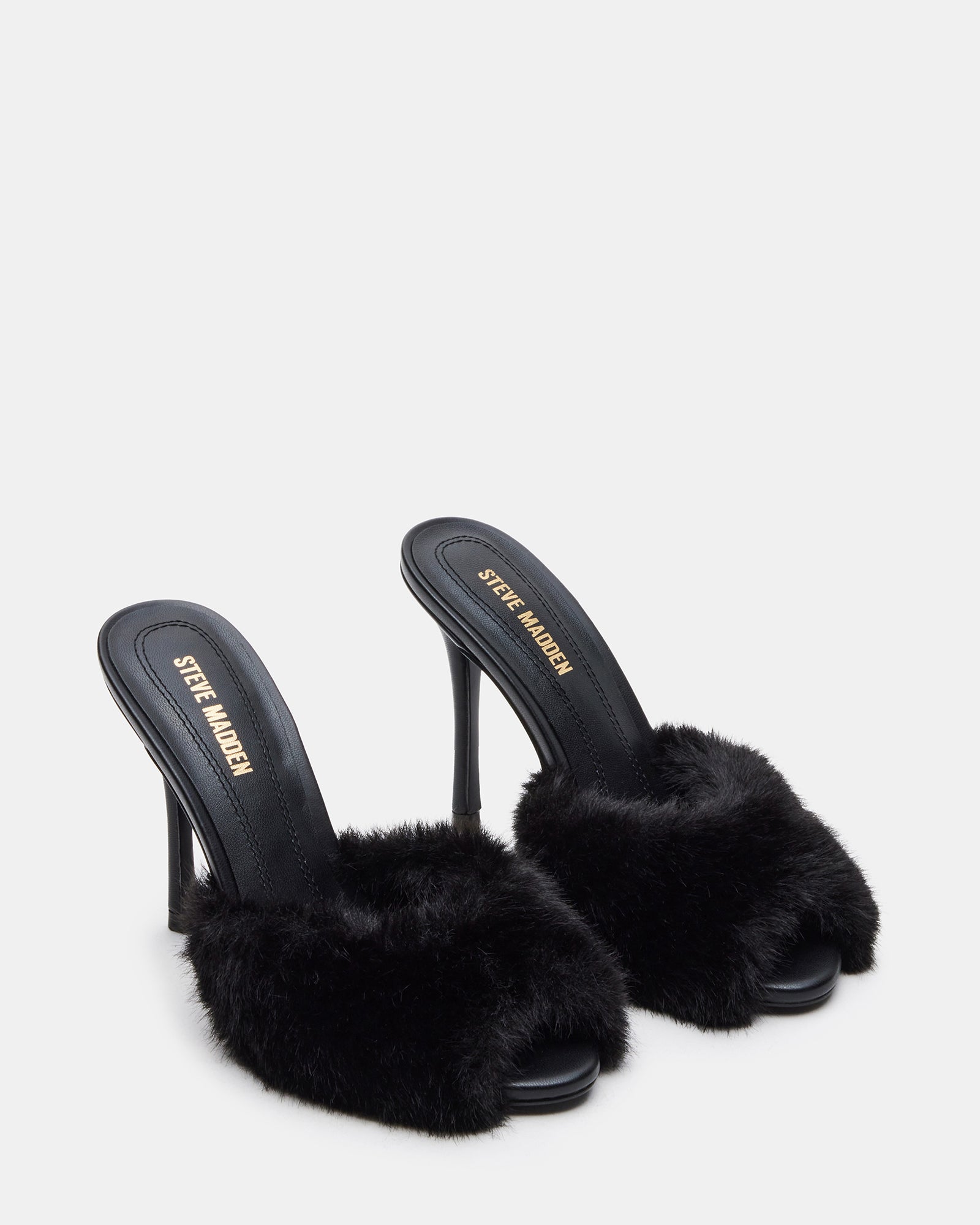 Top-down shot showcasing the soft faux fur strap and sleek leather base