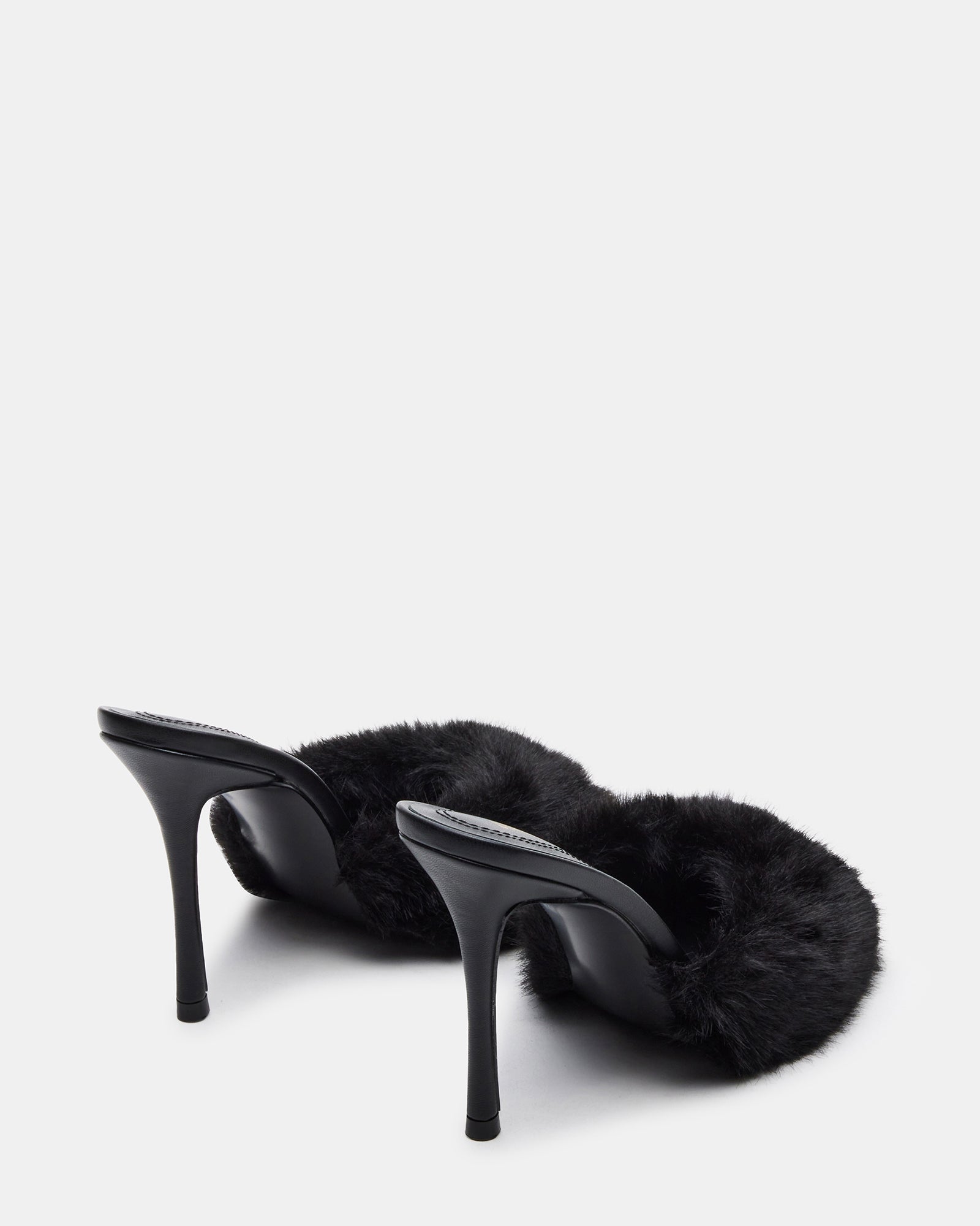 Top-down shot showcasing the soft faux fur strap and sleek leather base