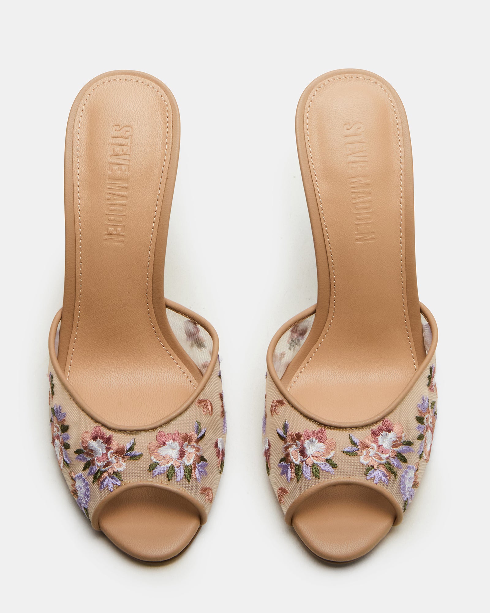 Close-up of stiletto sandals highlighting peep toe design