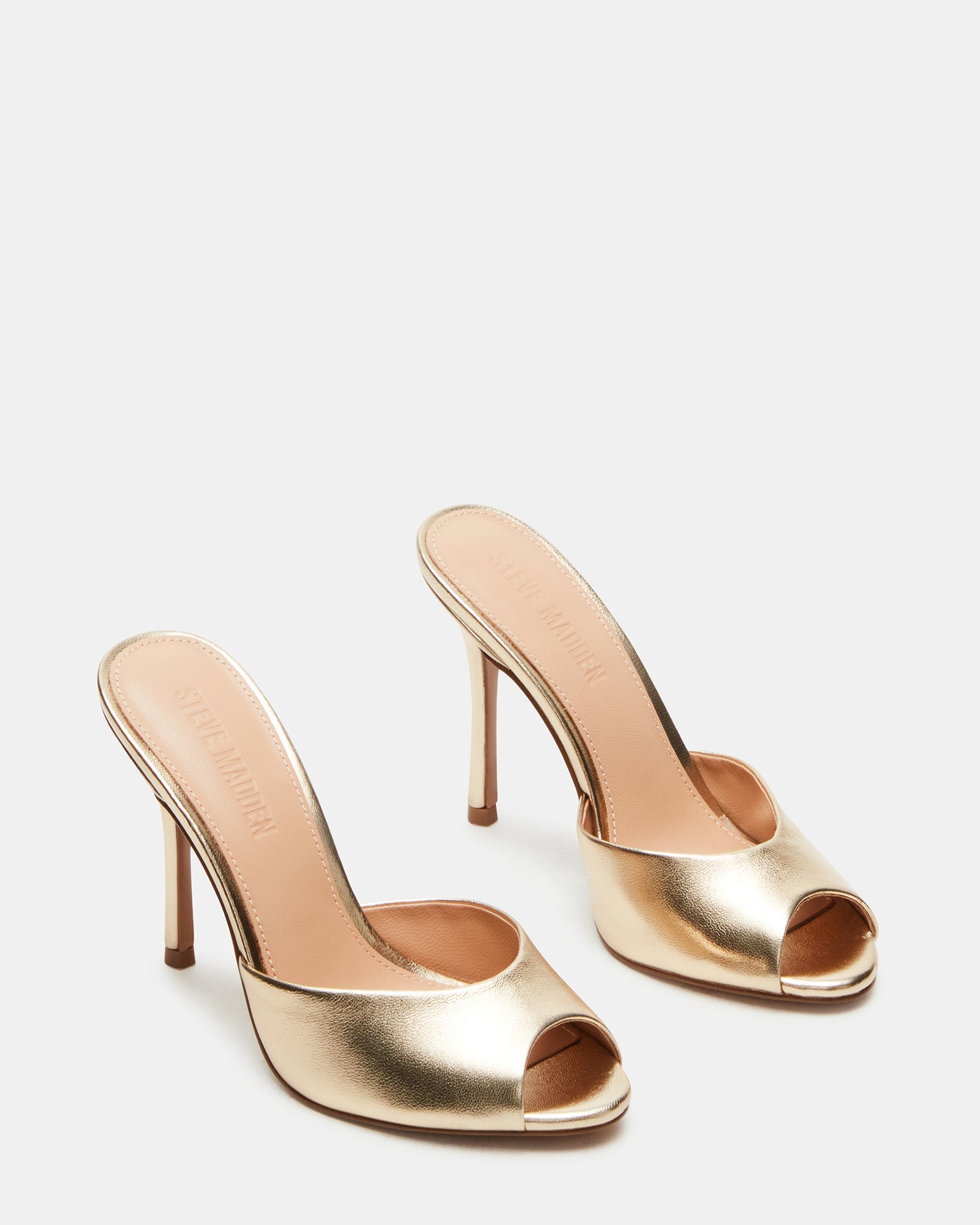 Priya Gold sandals worn with a stylish outfit for a night out