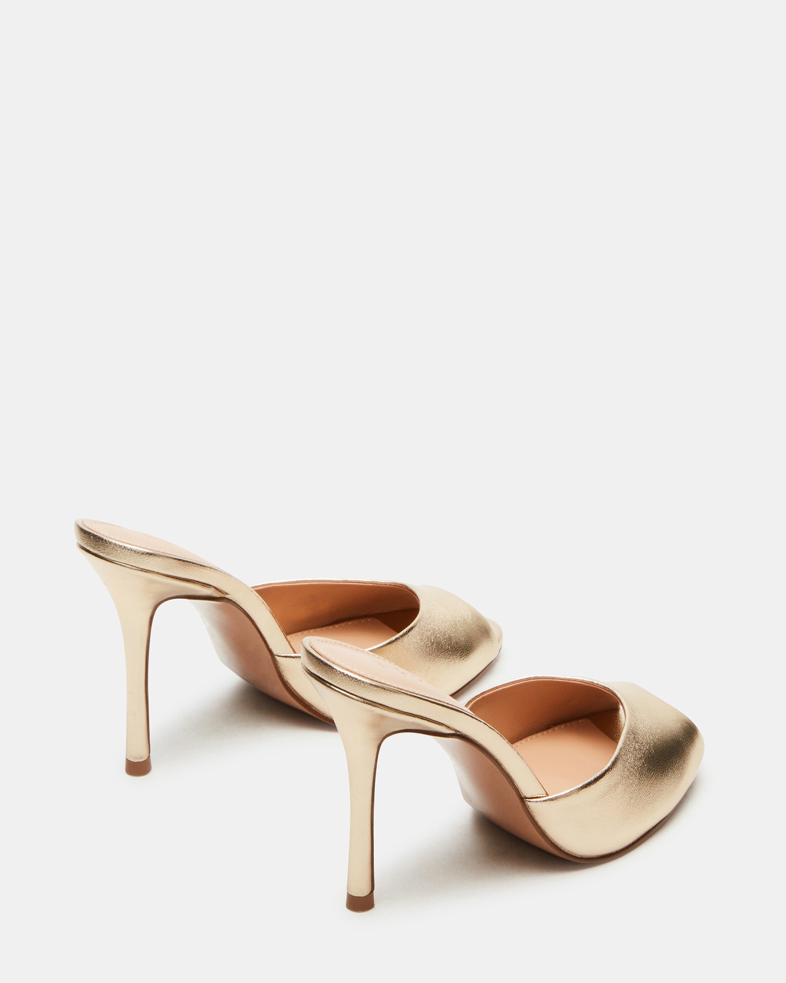 Priya Gold sandals worn with a stylish outfit for a night out