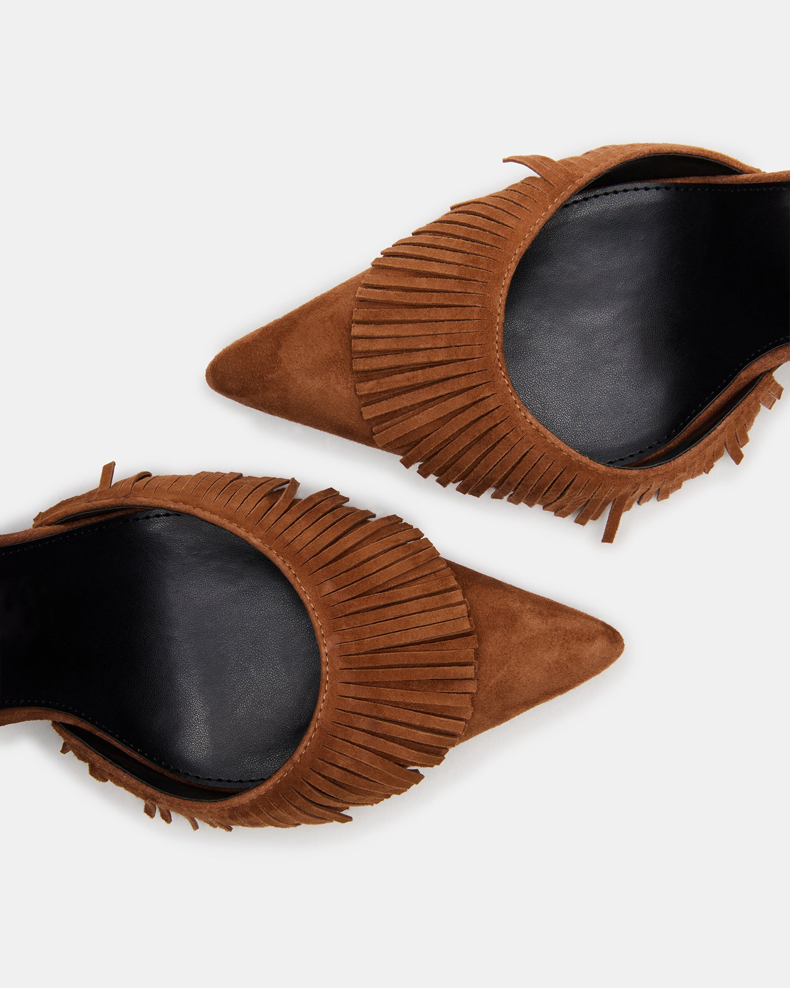 Side angle of the black suede heels highlighting crisscross back and pointed toe