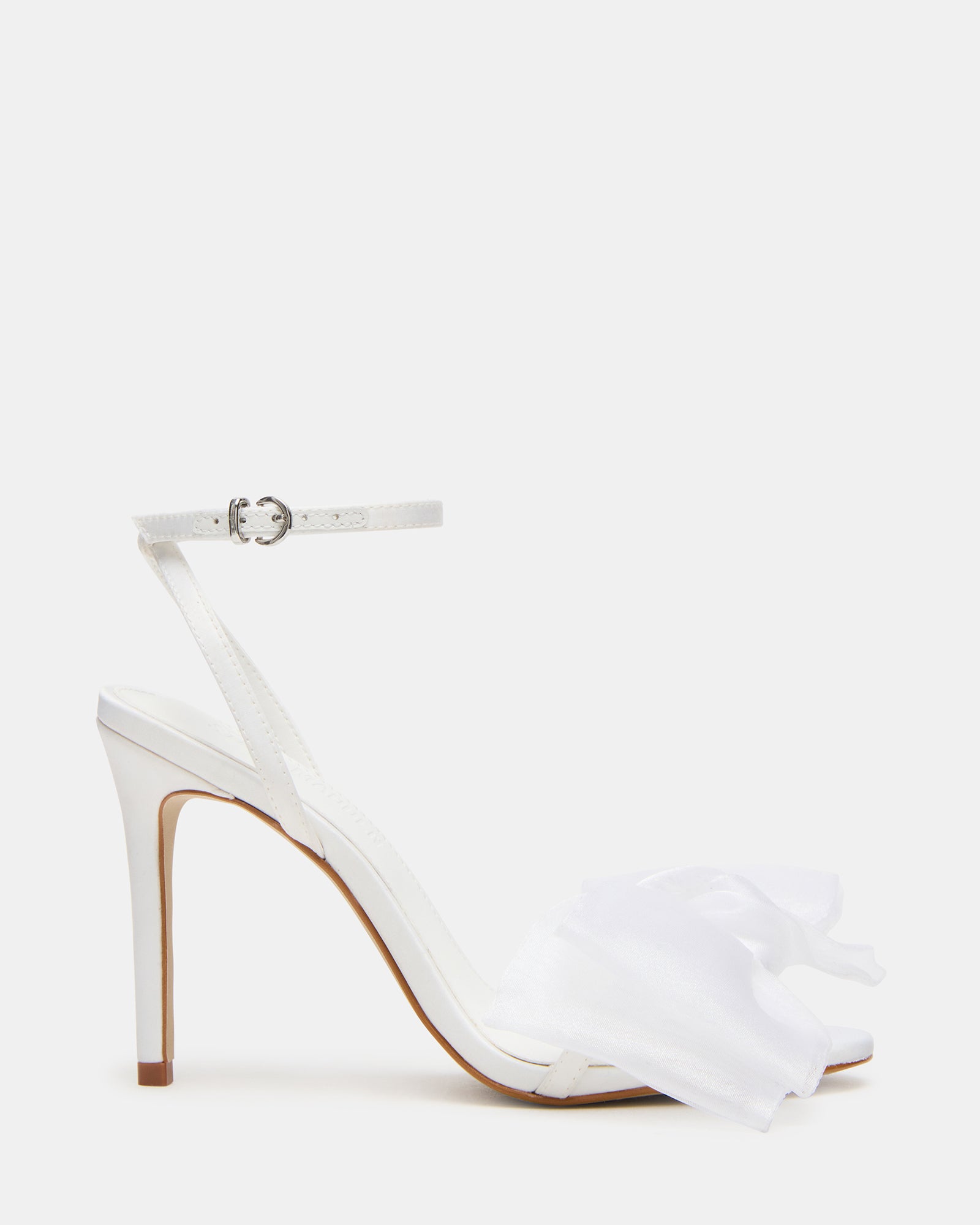 Side view of Radiance white strappy heels with bow and 4 inch heel
