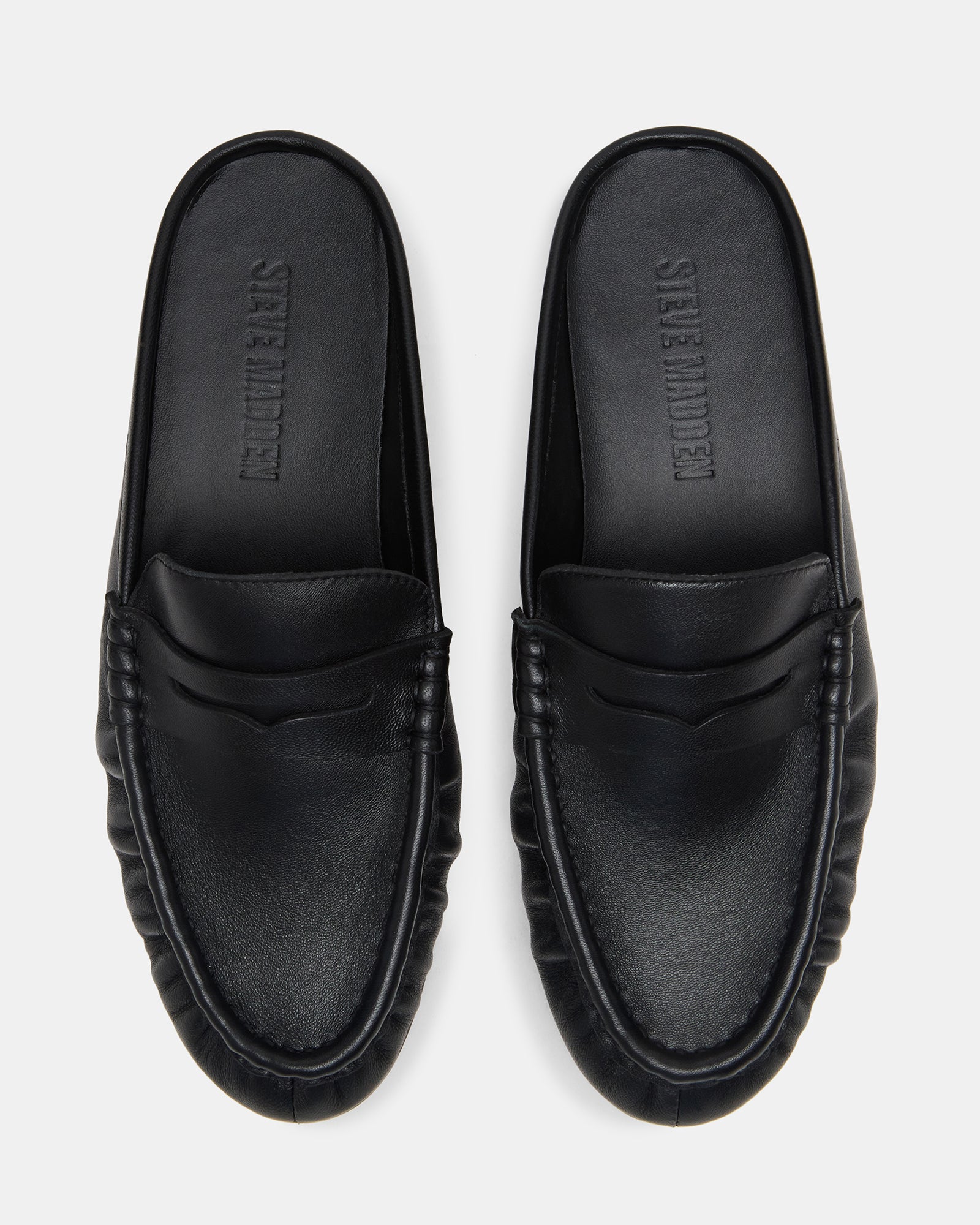 Front view of black leather ballet flats with rounded toe and minimalistic style