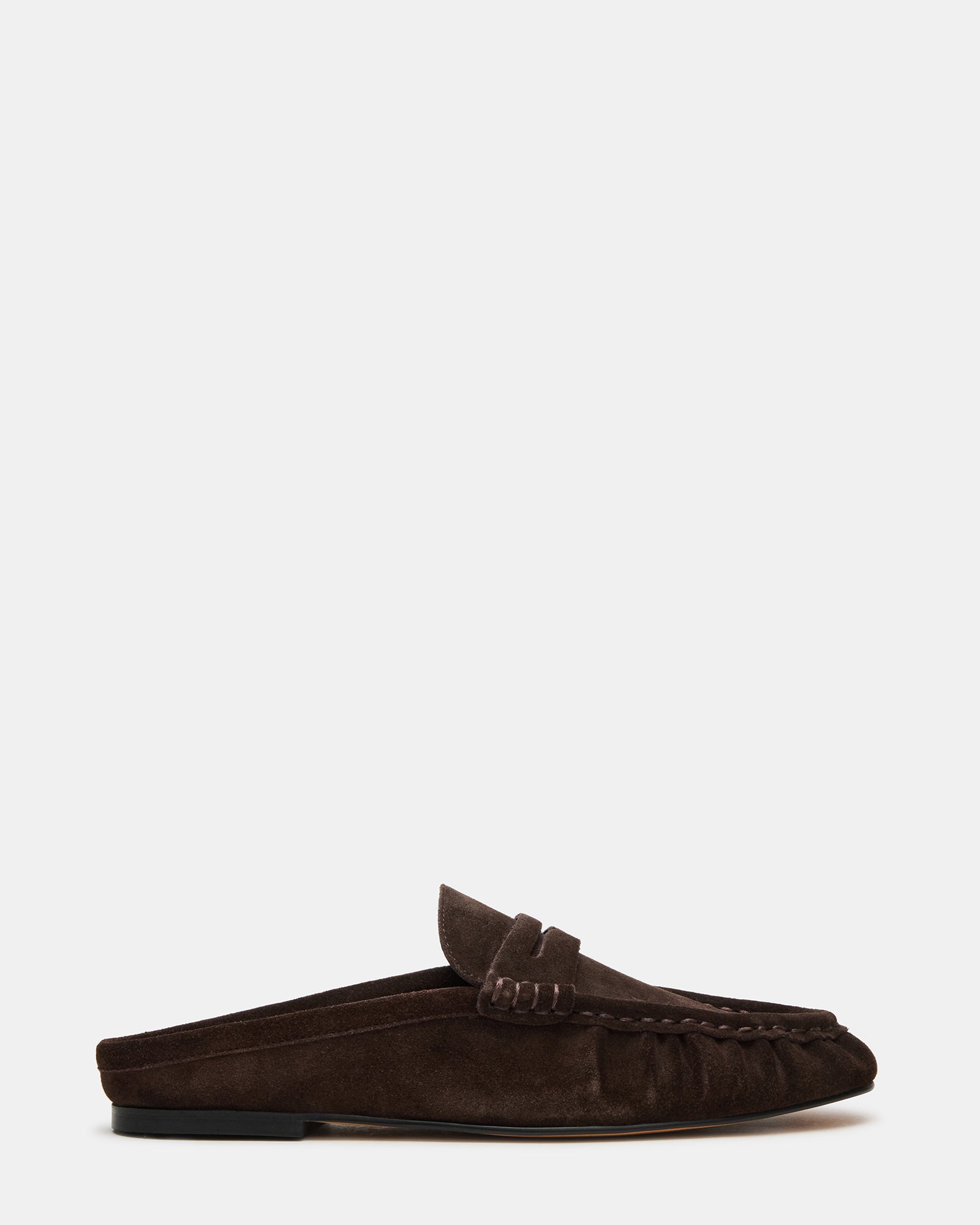Side view of chocolate brown slip-on shoes with suede finish