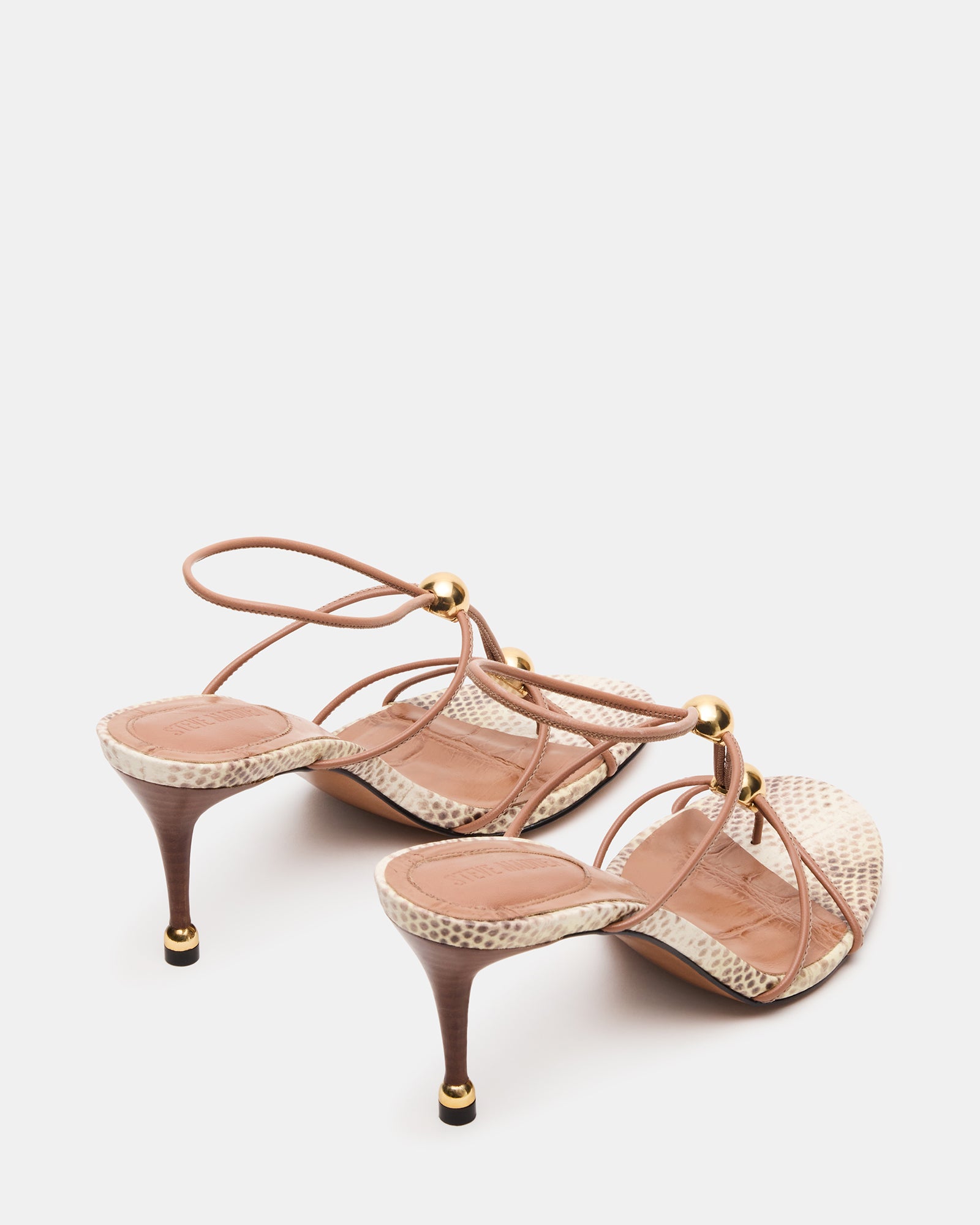 Close-up of the strap and heel detail on RAMOS stiletto shoes