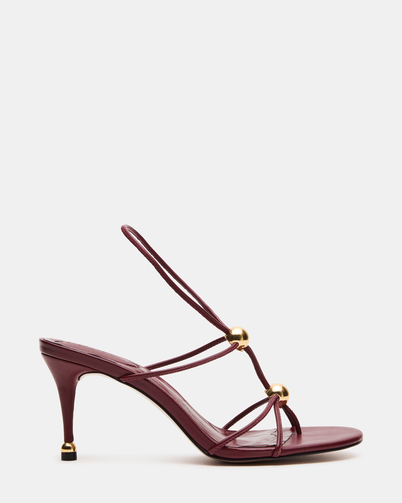 Side view of Ramos Strappy Stiletto Heels with gold accents.