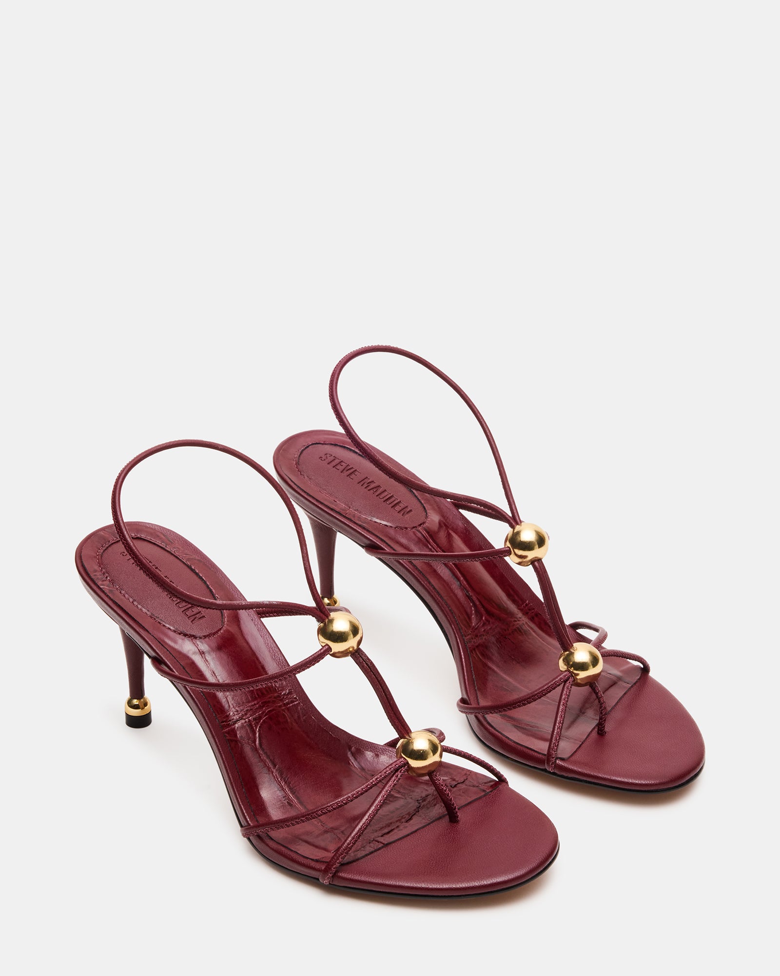 Close-up of the elegant gold hardware on the Ramos heels.