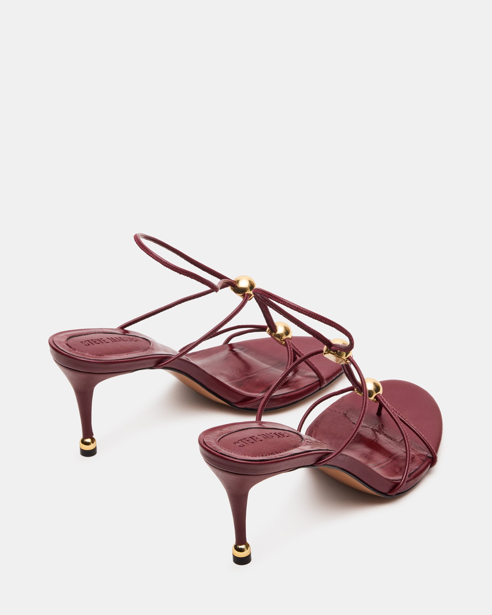 Close-up of the elegant gold hardware on the Ramos heels.
