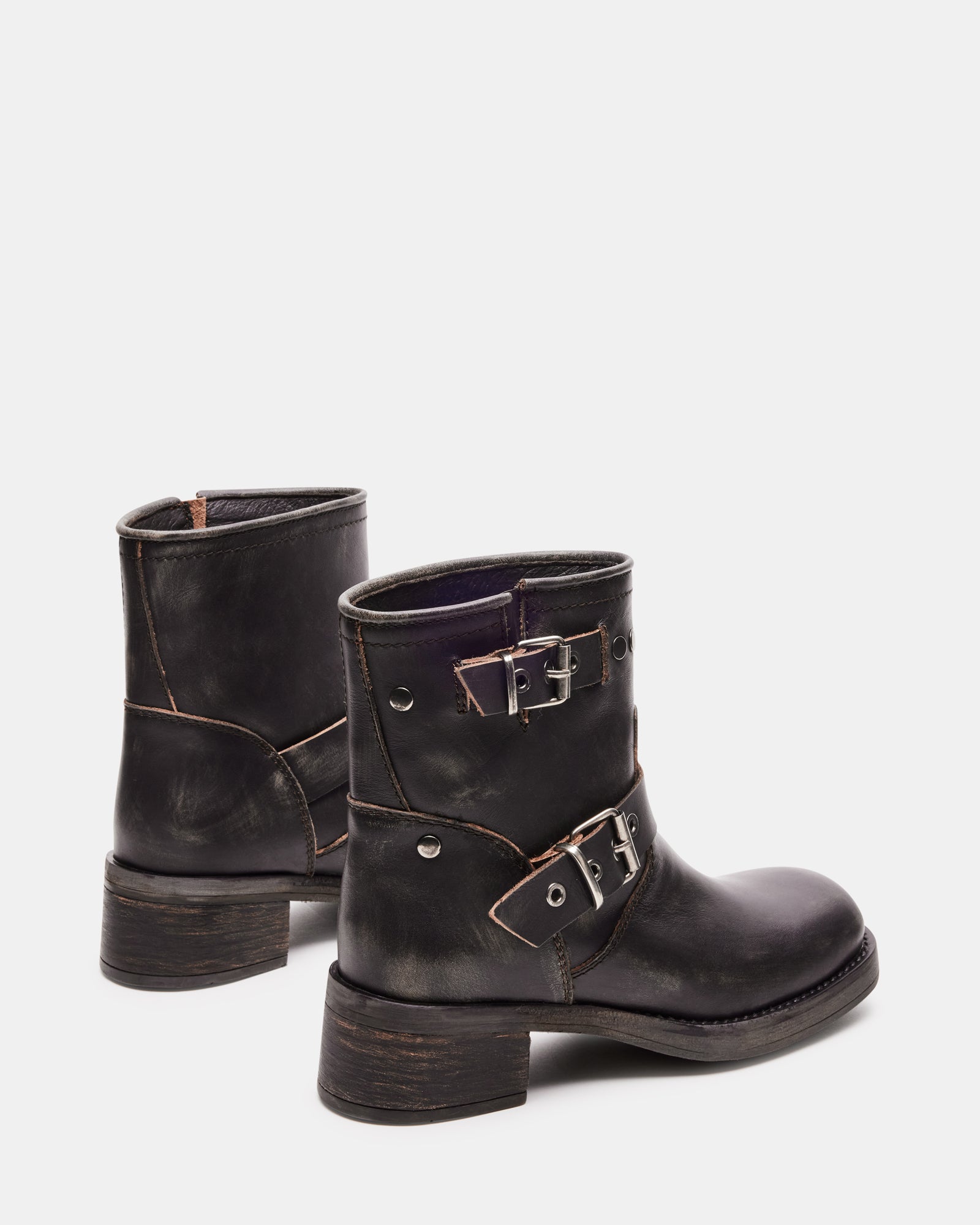 Top-down view of black moto boots variant with signature stitching