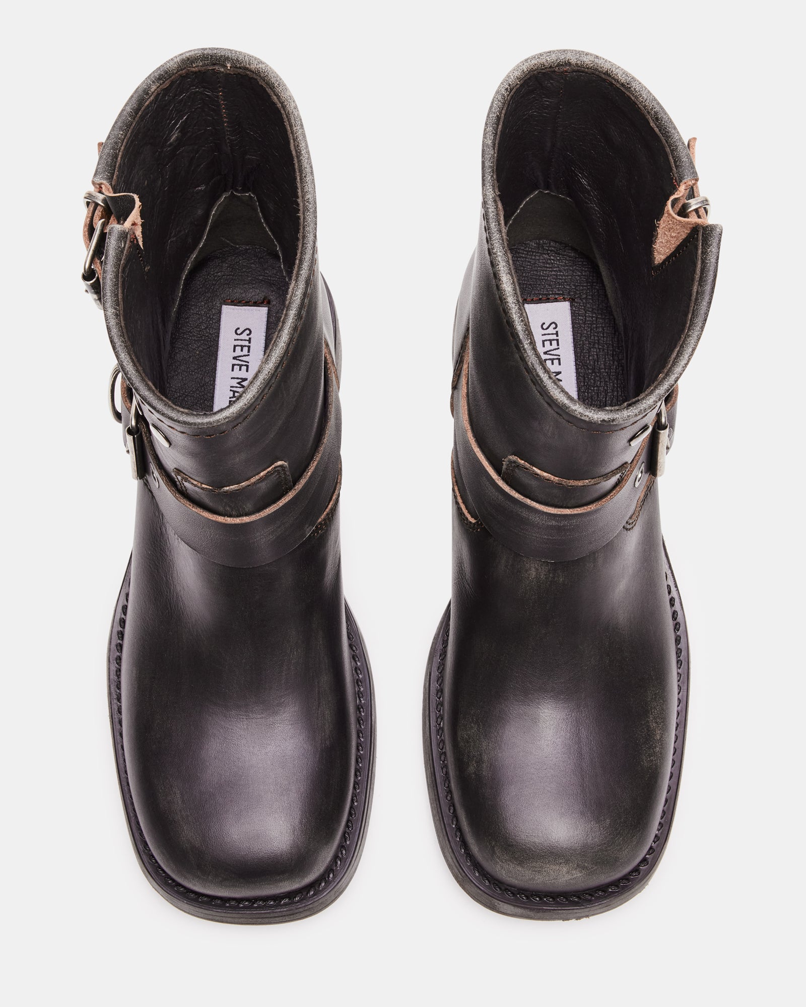 Rear heel shot showing ankle booties with lug sole traction