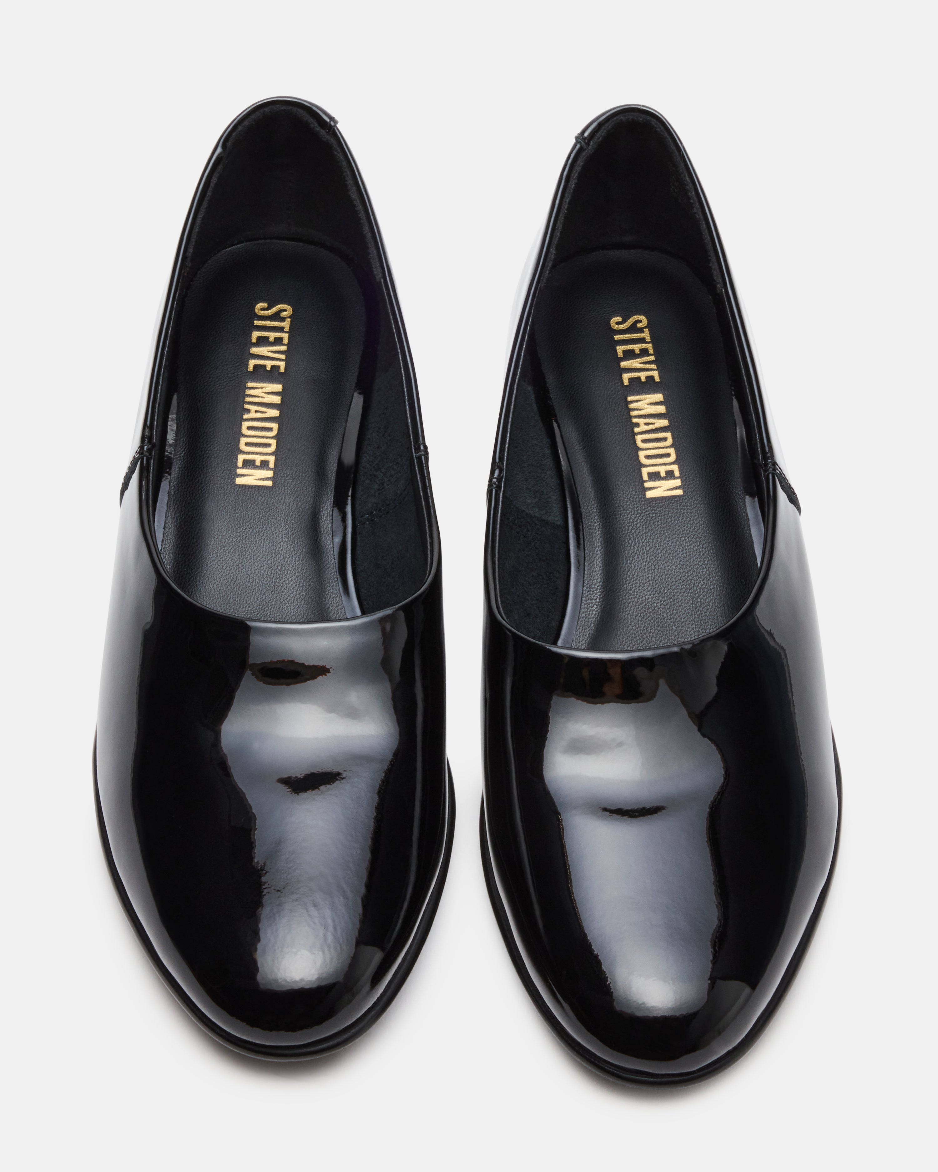 Close-up of Randall black patent ballet flats showing glossy finish