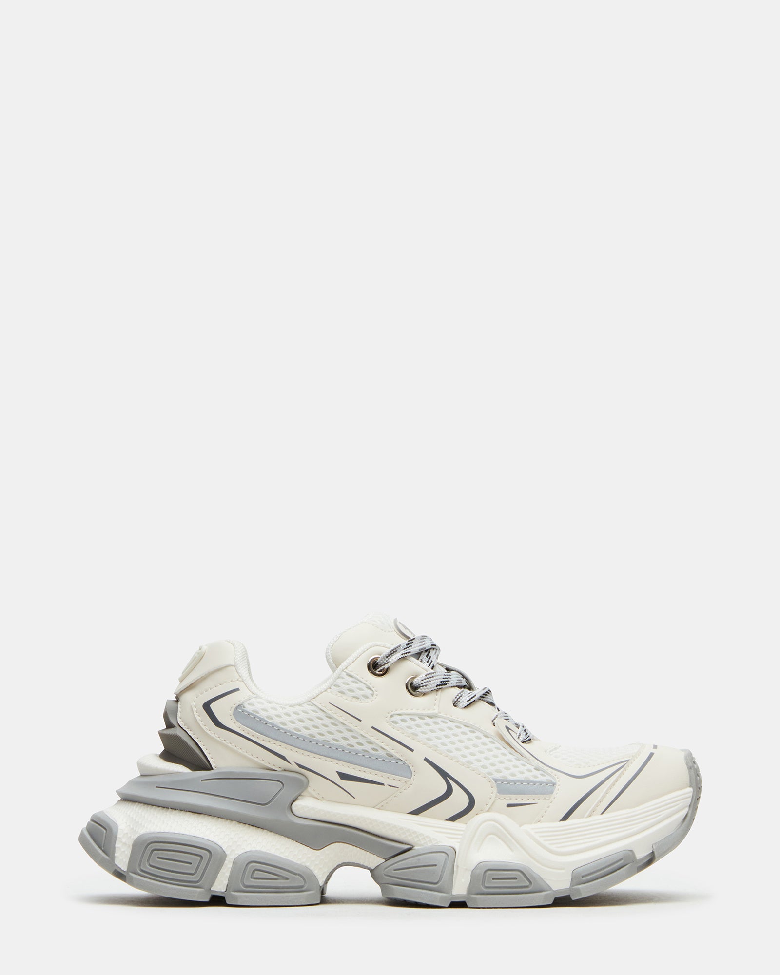 Side view of white platform sneakers showcasing chunky sole design