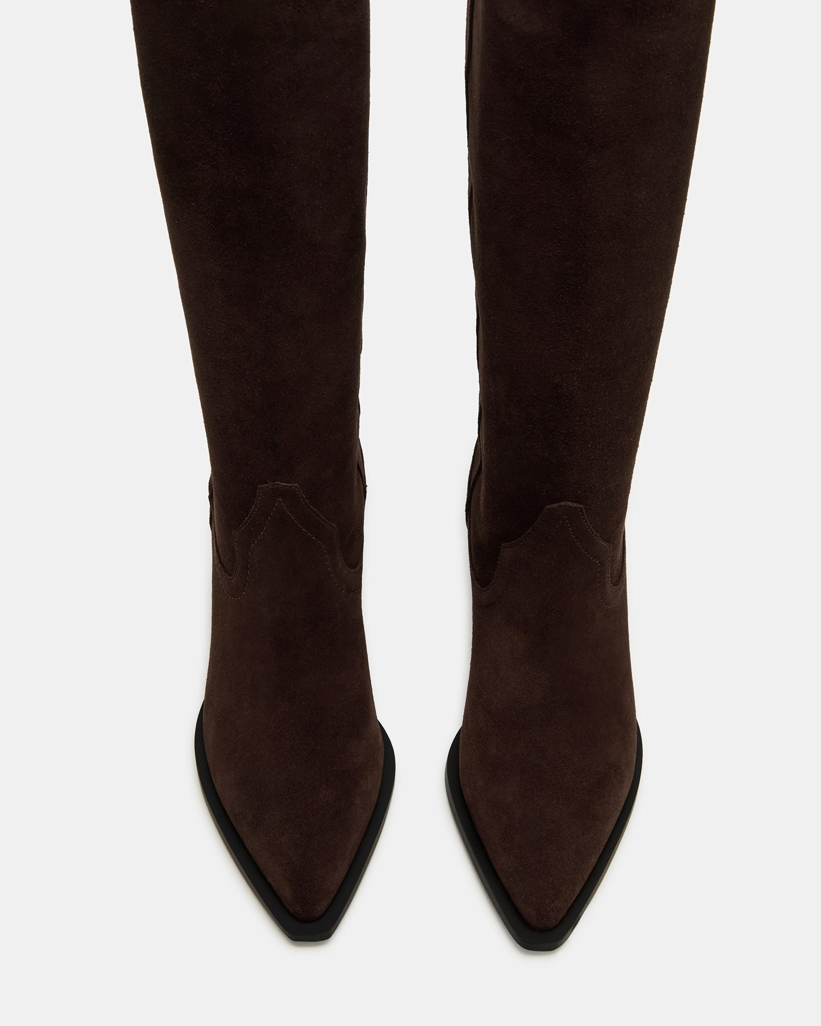 Side profile of brown suede boots with western-inspired under-the-knee design