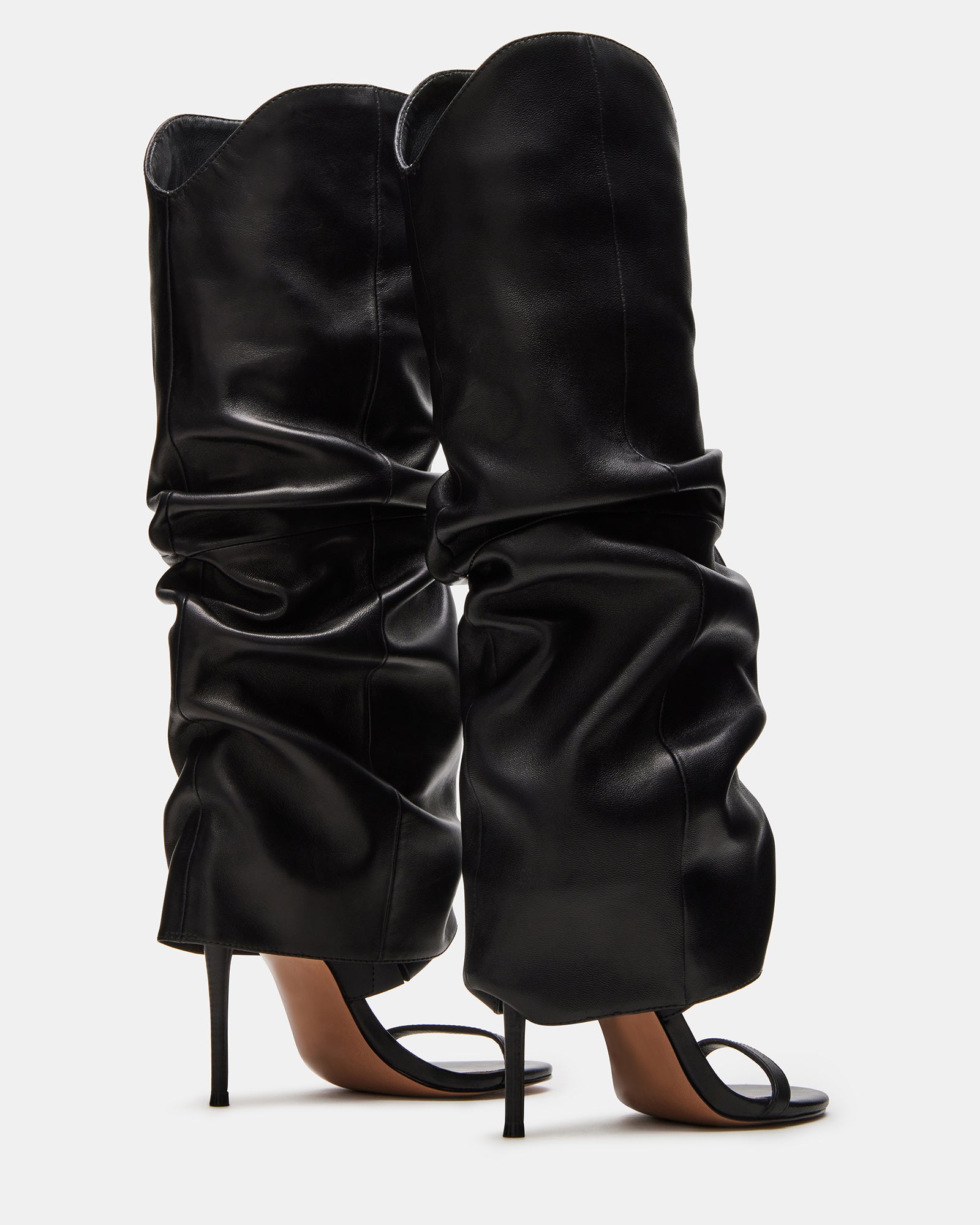The Ravine Luxe boot styled with a chic outfit, perfect for a night out.