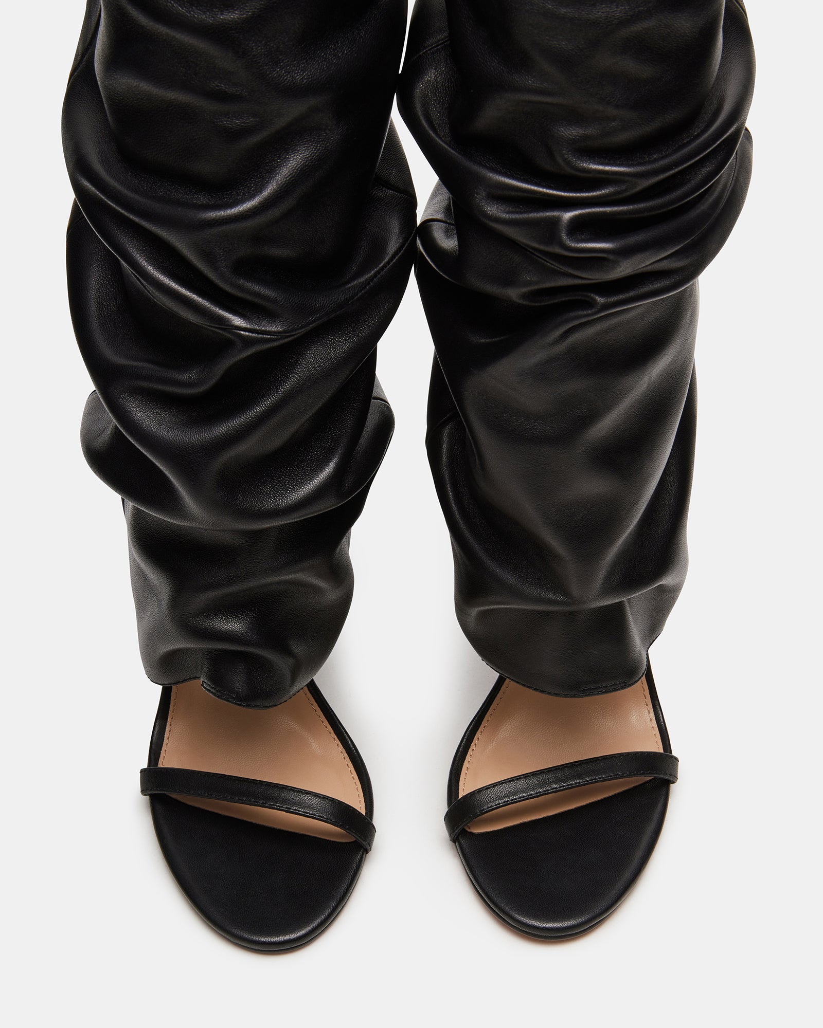 Close-up of the open toe feature on the Ravine Luxe boot, highlighting vegan leather material.