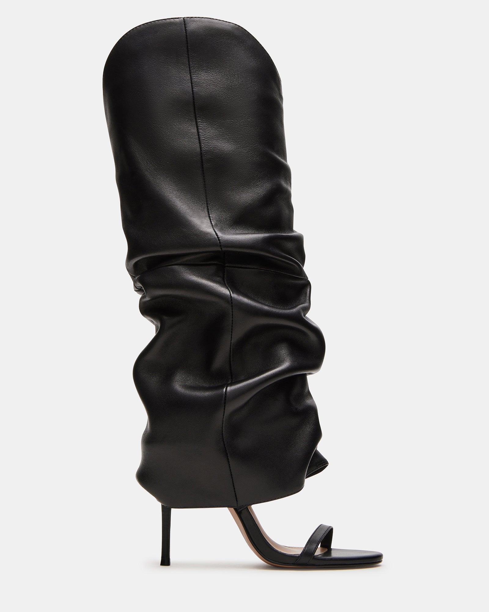 Black knee-high stiletto boot from the side, showcasing its elegant design.